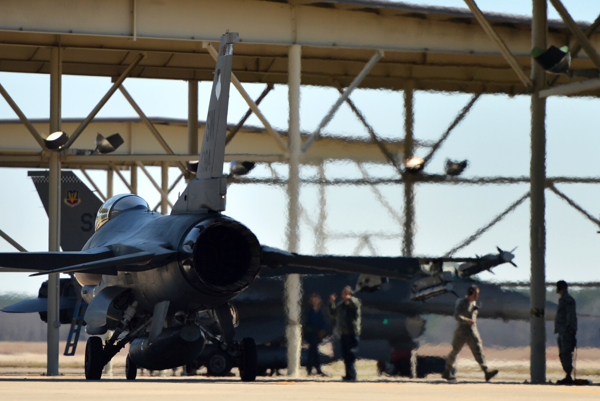 A U.S. Air Force F-16CJ Fighting Falcon taxies from its parking spot, March 21, 2014, Shaw Air Force Base, S.C. During takeoff and landing, fighter pilots rely on an Aircraft Arresting System which is designed to stop aircraft during emergency situations like break failure. Airmen assigned to the 20th Civil Engineer Squadron recently worked with a 55th Fighter Squadron pilot to test the AAS for accuracy and proper function. (U.S. Air Force photo by Staff Sgt. Kenny Holston/Released)