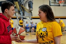 Airmen from Seymour Johnson Air Force Base, N.C. assist an athlete at the Special Olympics, March 15, 2014, in Smithfield, N.C. During the event more than 70 volunteers from Seymour Johnson Air Force Base, N.C. helped facilitate the quarterly event for 600 North Carolina athletes. (U.S. Air Force photo/Airman 1st Class Shawna L. Keyes)