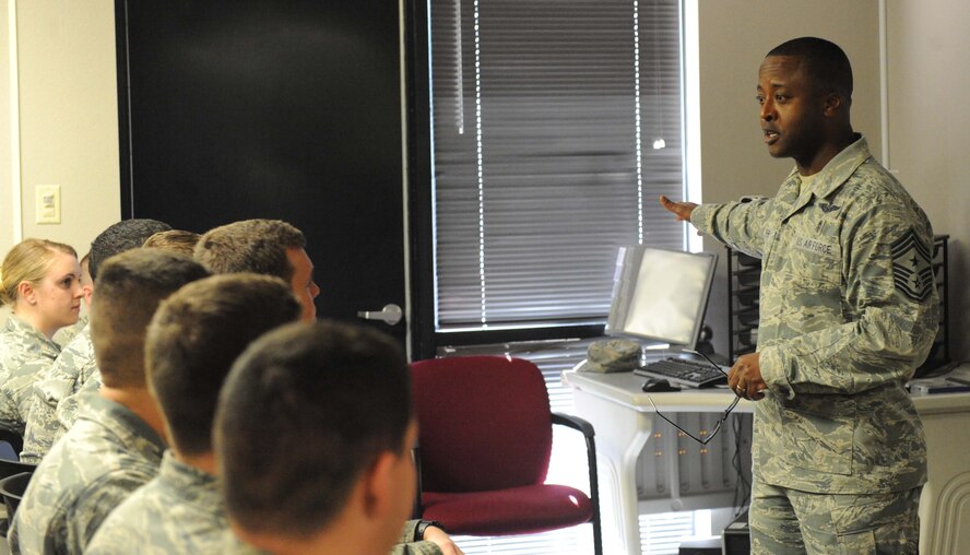 U.S. Air Force Chief Master Sgt. Eddie Webb, 7th Bomb Wing command chief, interacts with a First-Term Airman Class on Jan. 29, 2014, at Dyess Air Force Base, Texas.  Webb acts as the liaison between the wing commander and the wing’s enlisted force. He is the primary advisor to the commander on matters concerning the morale, welfare, training, professional development, career progression, and the effective utilization of the base’s enlisted force. (U.S. Air Force photo by Airman 1st Class Autumn Velez/Released)
