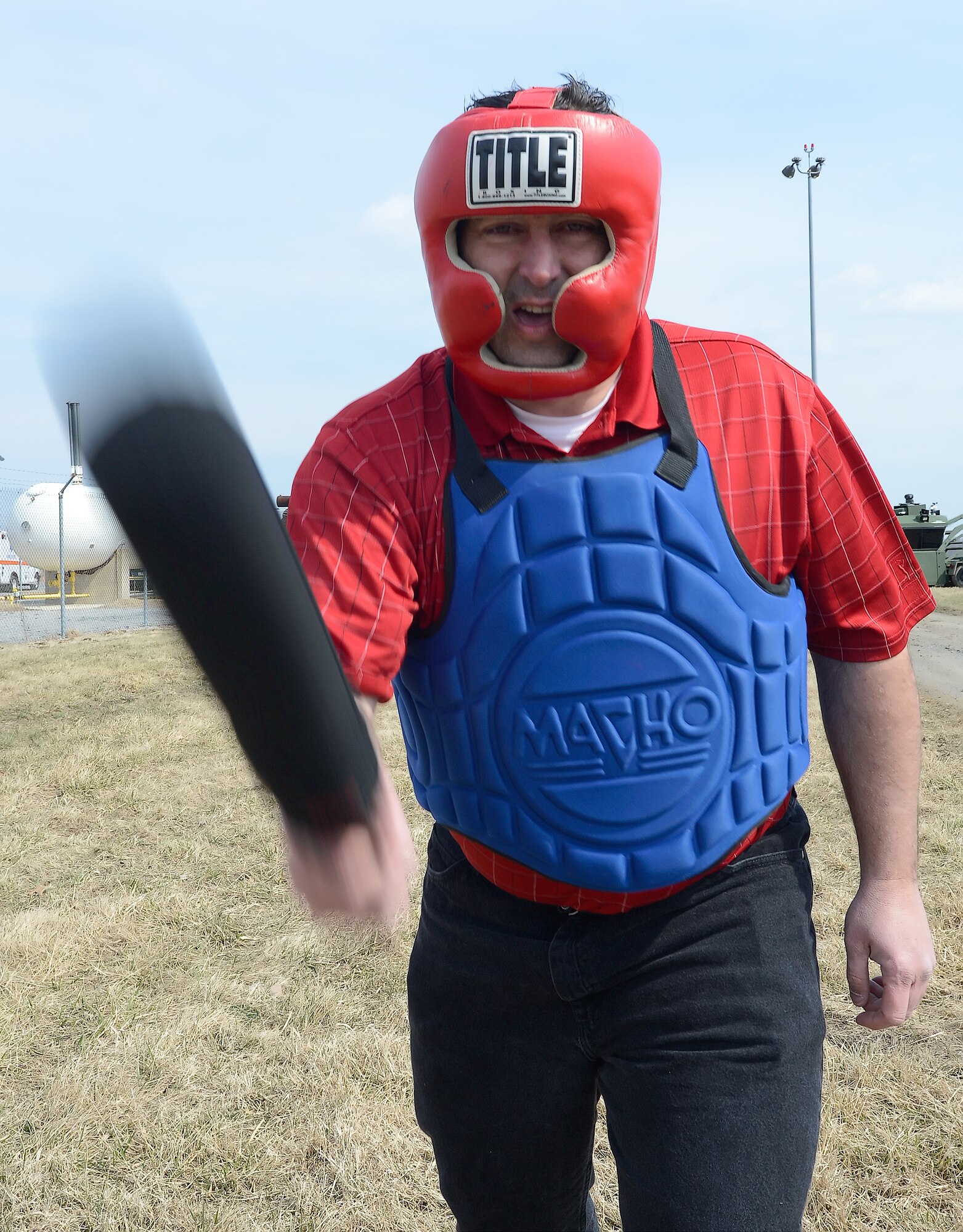 Charles Gray, 436th Medical Dental Squadron Honorary Commander, takes a swing with a padded Armament Systems and Procedures (ASP) baton during a training session with the 436th Security Forces Squadron on March 21, 2014, at Dover Air Force Base, Del. Gray, along with other Honorary Commanders, were trained how to effectively use the ASP baton and then allowed to put the training into action by sparring with an opponent. (U.S. Air Force photo/Greg L. Davis)