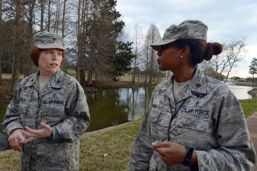 U.S. Air Force Col. Julie Stola, U.S. Air Forces Central Command deputy command surgeon (left), walks around Memorial Lake with Maj. Debra Sims, AFCENT chief of clinical operations, during a mentoring session, Shaw Air Force Base, S.C., March 25, 2014. Stola takes time out of her day to mentor junior officers about professional and personal matters in an effort to help others through life. (U.S. Air Force photo by Airman 1st Class Jonathan Bass/Released)