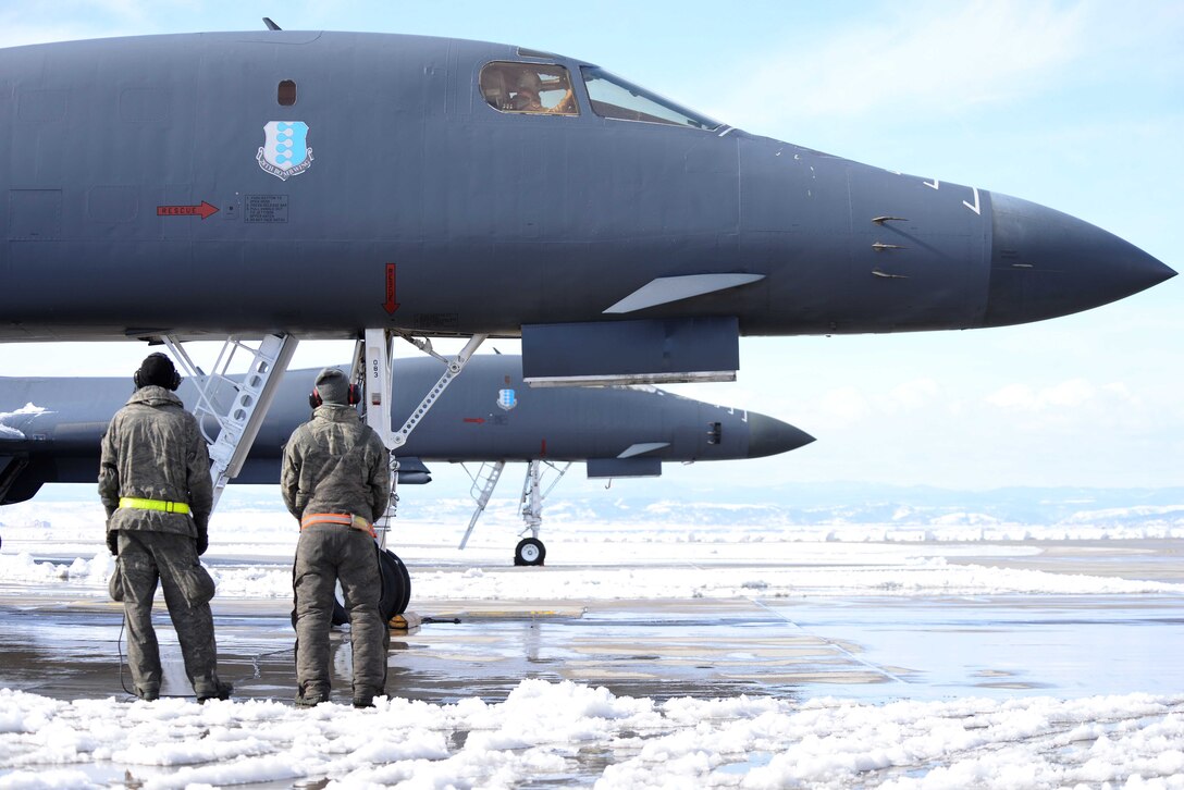 Crew chiefs assigned to the 28th Aircraft Maintenance Squadron ensure all systems are sound on a B-1 bomber prior to a mission at Ellsworth, S.D., March 18, 2014. Aircrews from Ellsworth flew several B-1 bombers to a forward operating location is Southwest Asia, replacing aircraft due for scheduled maintenance.  (U.S. Air Force photo by Airman 1st Class Rebecca Imwalle /Released) 