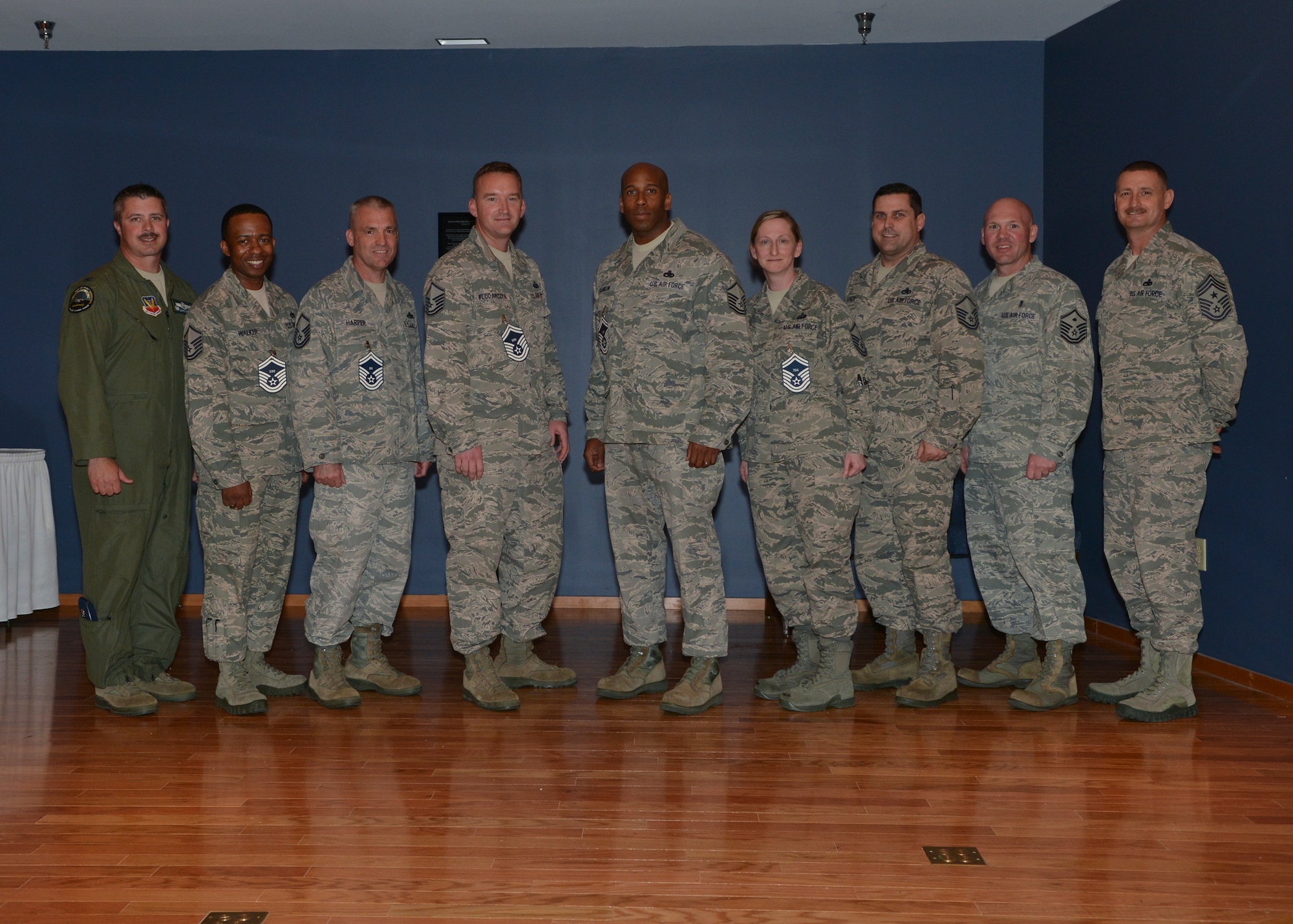 Col. David E. Graff, 325th Fighter Wing commander (far left) and Chief Master Sgt. Raymond F. DeVite, 325th FW Command Chief Master Sergeant (far right), pose for a group photo with Tyndall’s newest senior master sergeant selectees March 21 at the Horizons ballroom.  (U.S. Air Force photo by Staff Sgt. Javier Cruz)