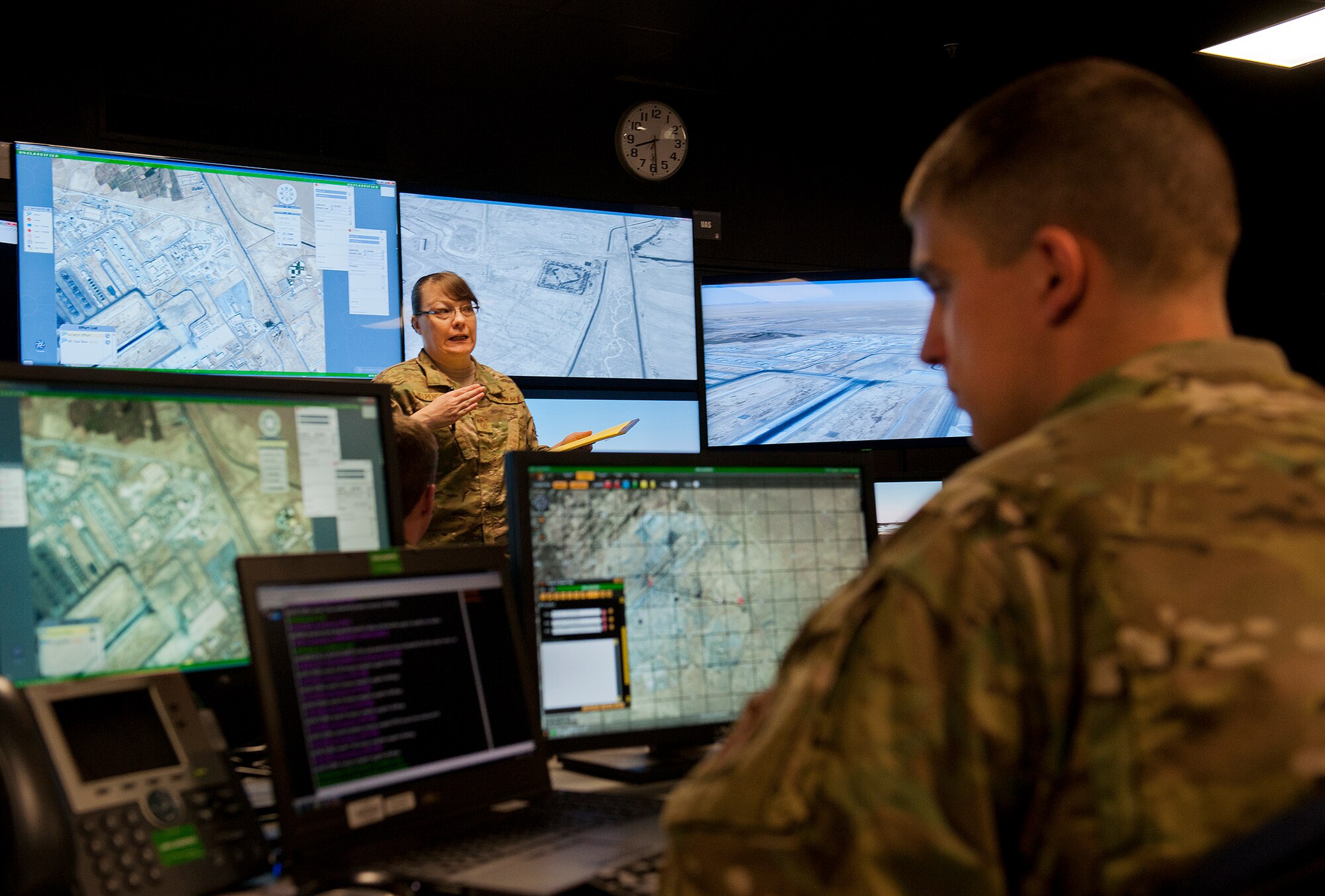 Senior Master Sgt. Michelle Helpenstell, a reservist from the 446th Security Forces Squadron at McChord Air Force Base, Wash., briefs the group as the battle captain, during a Joint Defense Operations Center exercise at Eglin AFB, Fla., March 21. The exercise simulated real-world force protection conditions at Kandahar Air Field, Afghanistan, to help deployers have specific location training before arriving to their new assignment. The training was facilitated by the 96th Ground Combat Training Squadron. (U.S. Air Force photo/Samuel King Jr.)