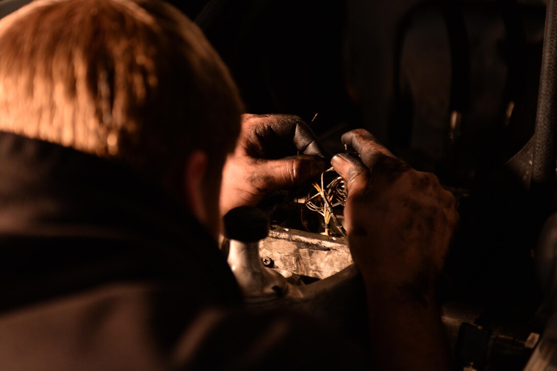 David Wonsitler, 28th Aircraft Maintenance Squadron electrical environmental technician, wires a brake temperature sensor on a B-1 bomber at Ellsworth Air Force Base, S.D., March 18, 2014. All B-1s will be upgraded with a new brake systems by January 2015 designed to be more robust with a longer lifespan than previous brakes. (U.S. Air Force photo by Airman 1st Class Rebecca Imwalle/ Released)