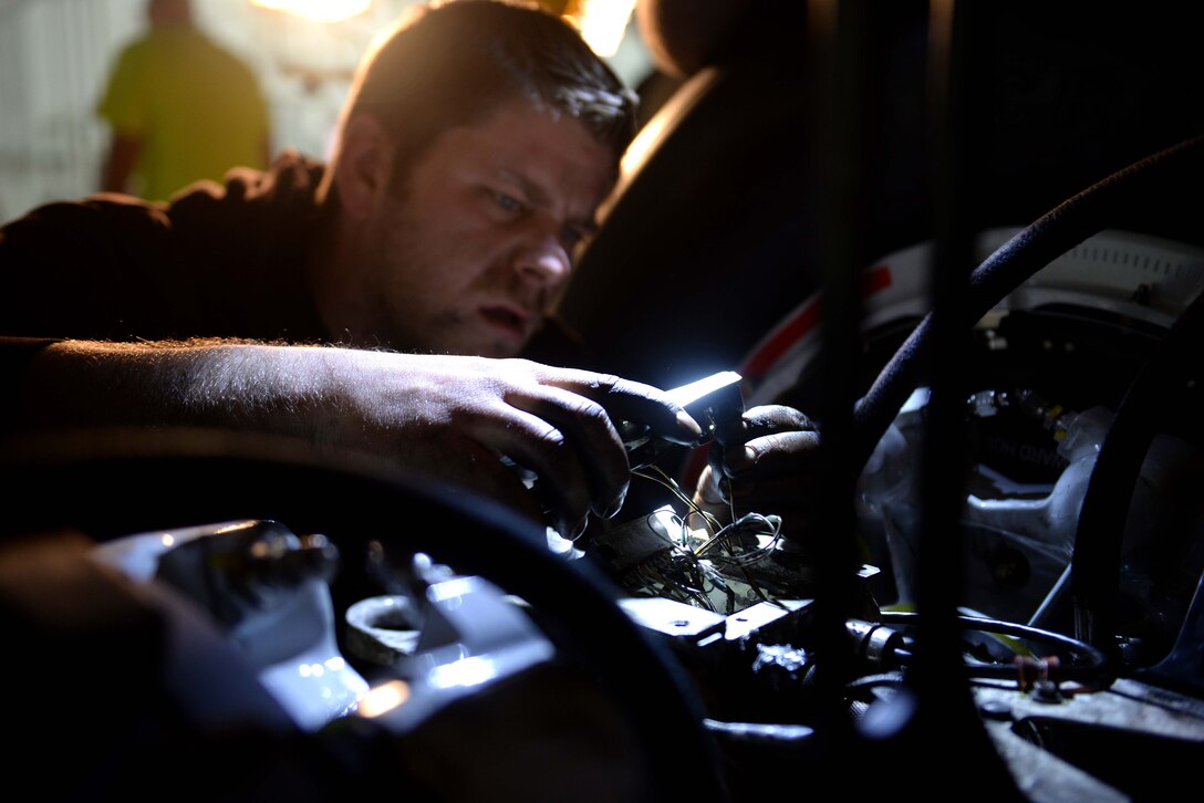 David Wonsitler, 28th Aircraft Maintenance Squadron electrical environmental technician, wires a brake temperature sensor on a B-1 bomber at Ellsworth Air Force Base, S.D., March 18, 2014. All B-1 bombers in the U.S. Air Force inventory are being upgraded with a state-of-the-art wheel and brake system that provides more durability to wheel components. (U.S. Air Force photo by Airman 1st Class Rebecca Imwalle/ Released)