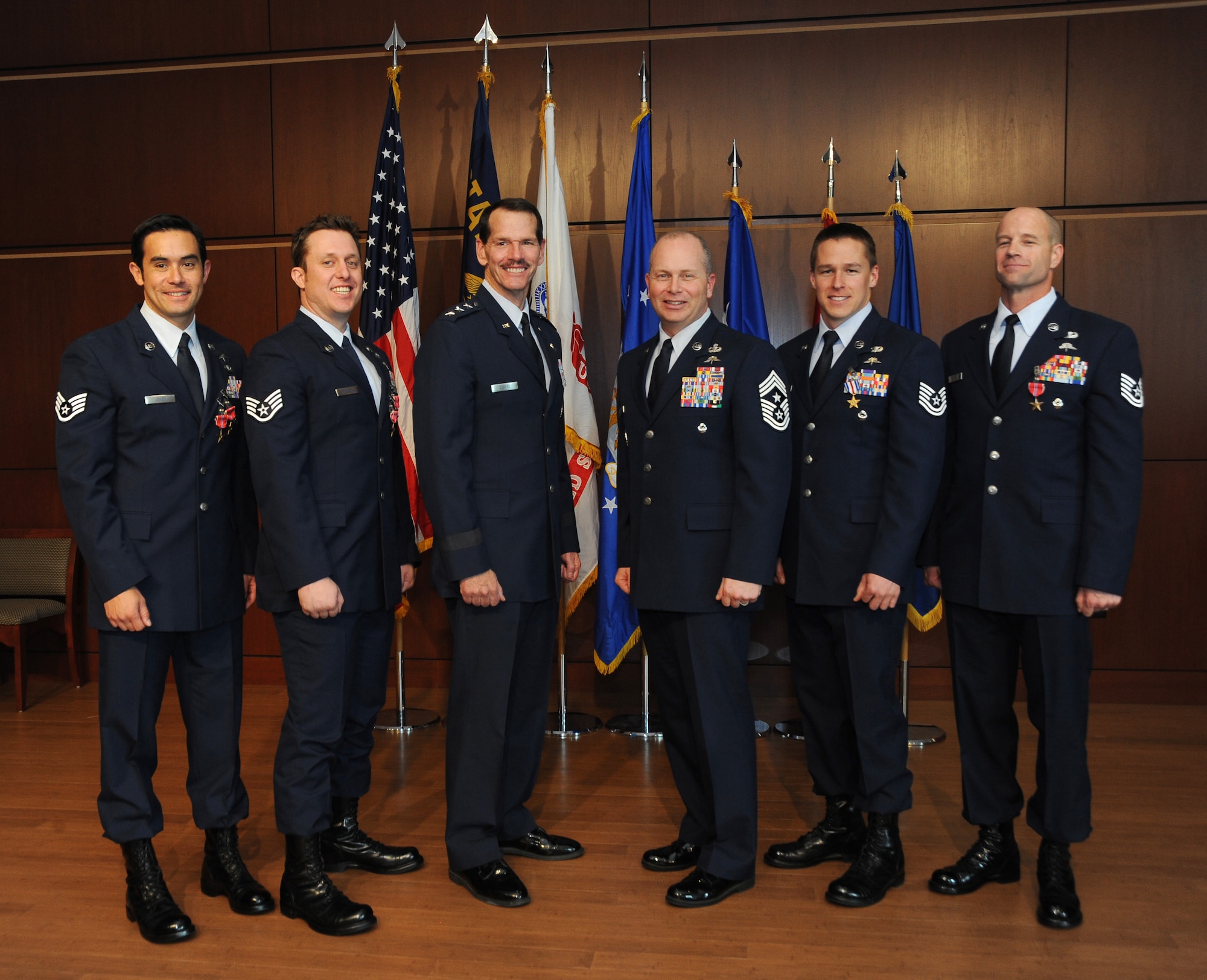 Combat controllers with the Oregon Air National Guard’s 125th Special Tactics Squadron pose for a group photo with Air National Guard Director Lt. Gen. Stanley E. Clarke III (third from left) and Air National Guard Command Chief Master Sergeant James W. Hotaling (center) following an award ceremony, March 24, at the 41st Infantry Division Armed Forces Reserve Center at Camp Withycombe, in Clackamas, Ore.  From left: Staff Sgt. Christopher Jones received the Bronze Star with Valor and first Oak Leaf Cluster; Staff Sgt. Matthew Matlock received the Bronze Star Medal with Valor and second Oak Leaf Cluster; Lt. Gen. Stanley Clarke; Chief Master Sergeant James Hotaling (a former Oregon Air Guard member); Tech. Sgt. Doug Matthews received the rarely awarded Silver Star; and Tech. Sgt. George Thompson received the Bronze Star. (Photo by Tech. Sgt. John Hughel, 142nd Fighter Wing Public Affairs)