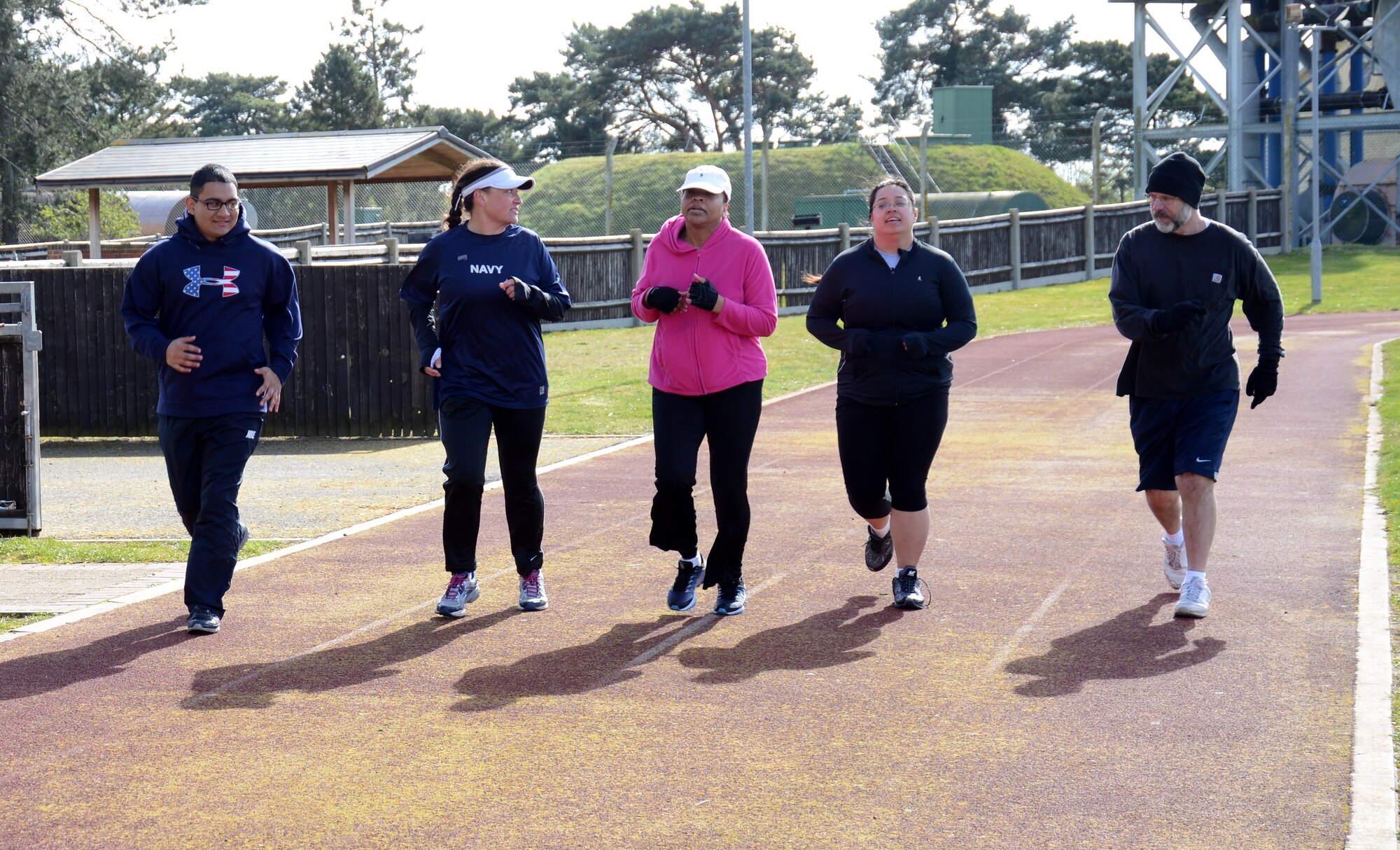 Members of the Black Team run together in the final event in a weight-loss group competition March 22, 2014, on RAF Mildenhall, England. The Team that wins each event receives points toward its overal score. The final weigh-in is scheduled to take place March 28. (U.S. Air Force photo by Airman 1st Class Kelsey Waters/Released)
