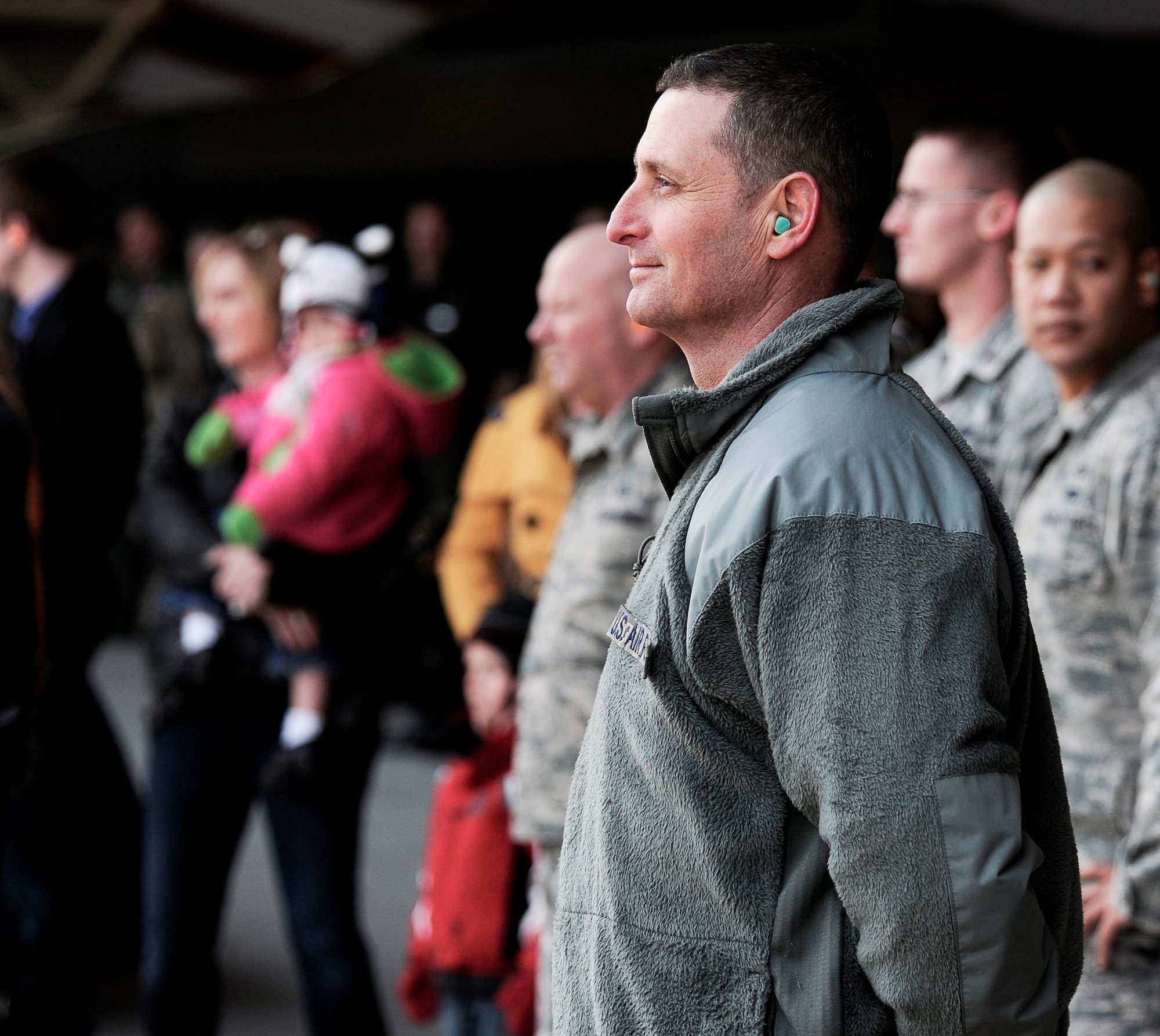 Chief Master Sgt. Raymond F. DeVite, 325th Fighter Wing command chief master
sergeant, stands in a crowd Jan. 6 in Hangar 2 as he watches the arrival of
five F-22 Raptors from Holloman AFB, New Mexico. The arrival of the
transferred F-22 Raptors marks the beginning of a transition of aircraft
from Holloman AFB to Tyndall AFB where they will be assigned to the 95th
Fighter Squadron. (U.S. Air Force photo by Staff Sgt. Javier Cruz)

