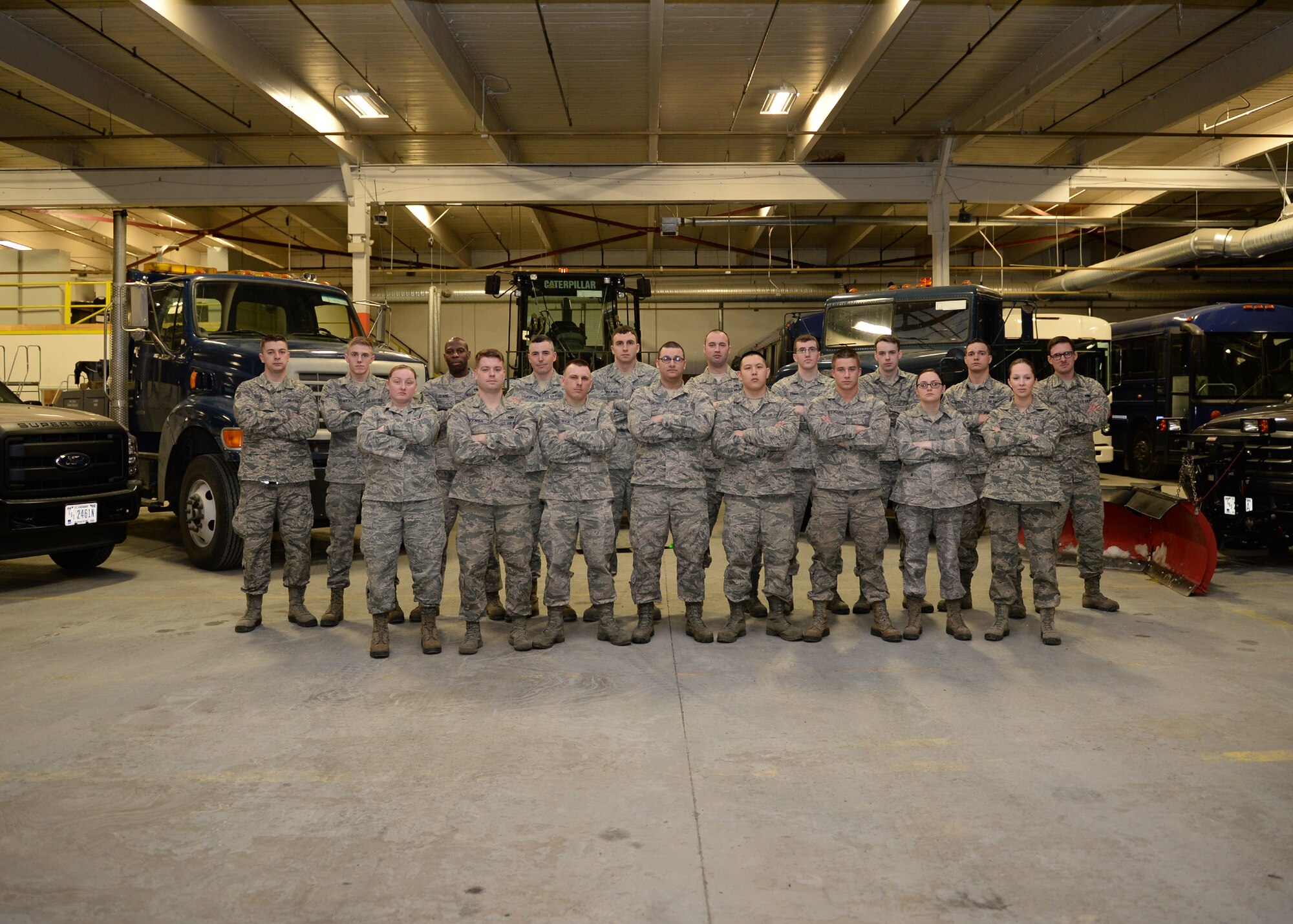 Vehicle operators from the day and graveyard shift pose for a photo at the 354th Logistic Readiness Squadron March 19, 2014 Eielson Air Force Base, Alaska. Airmen from the flight are licensed to operate several different types of vehicles to support Eielson’s missions. (U.S. Air Force photo by Staff Sgt. Shawn Nickel/Released)