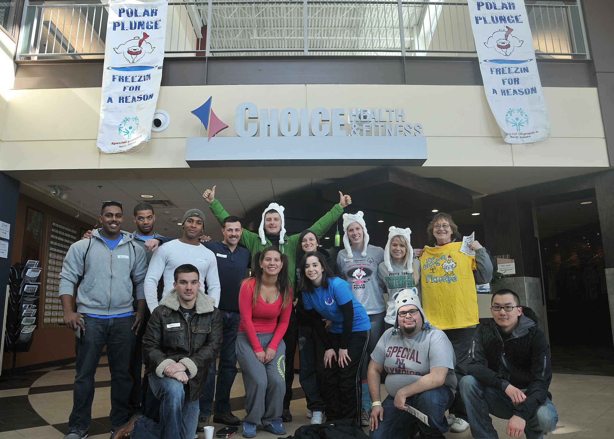 Members of the 319th Air Base Wing pose for a photo during the sixth annual Polar Plunge on March 22, 2014, at the Choice and Health Fitness Center in Grand Forks, N.D. The Polar Plunge is a fundraising event for the North Dakota Special Olympics in which participants are sponsored for diving into a low-temperature pool and judged on how big a splash they make. (U.S. Air Force photo/Senior Airman Xavier Navarro)
