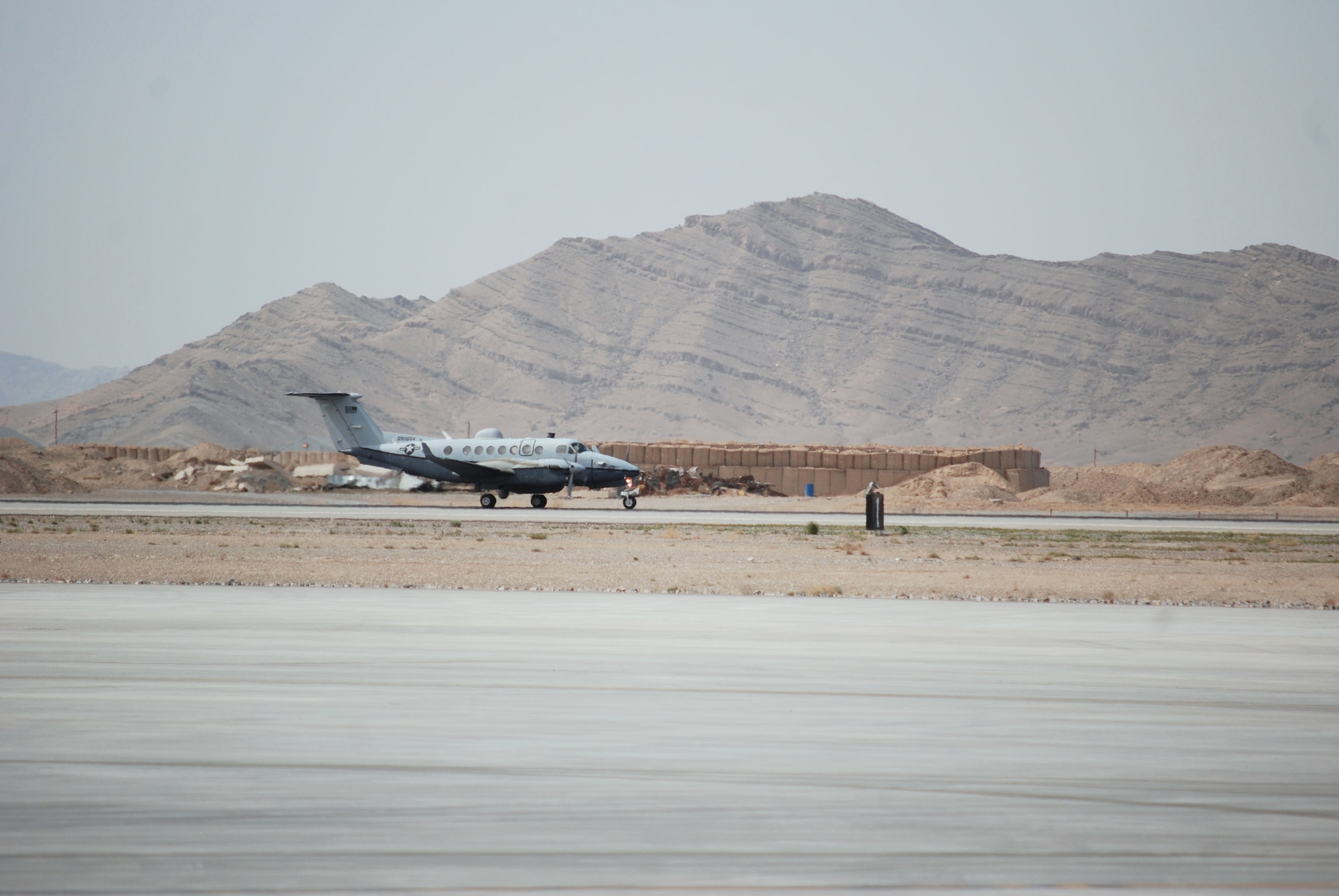 An MC-12W Liberty departs Kandahar Airfield, March 20, 2014. The MC-12W is assigned to and operated by the 451st Air Expeditionary Group. (U.S. Air Force photo by Capt. Brian Wagner/Released)