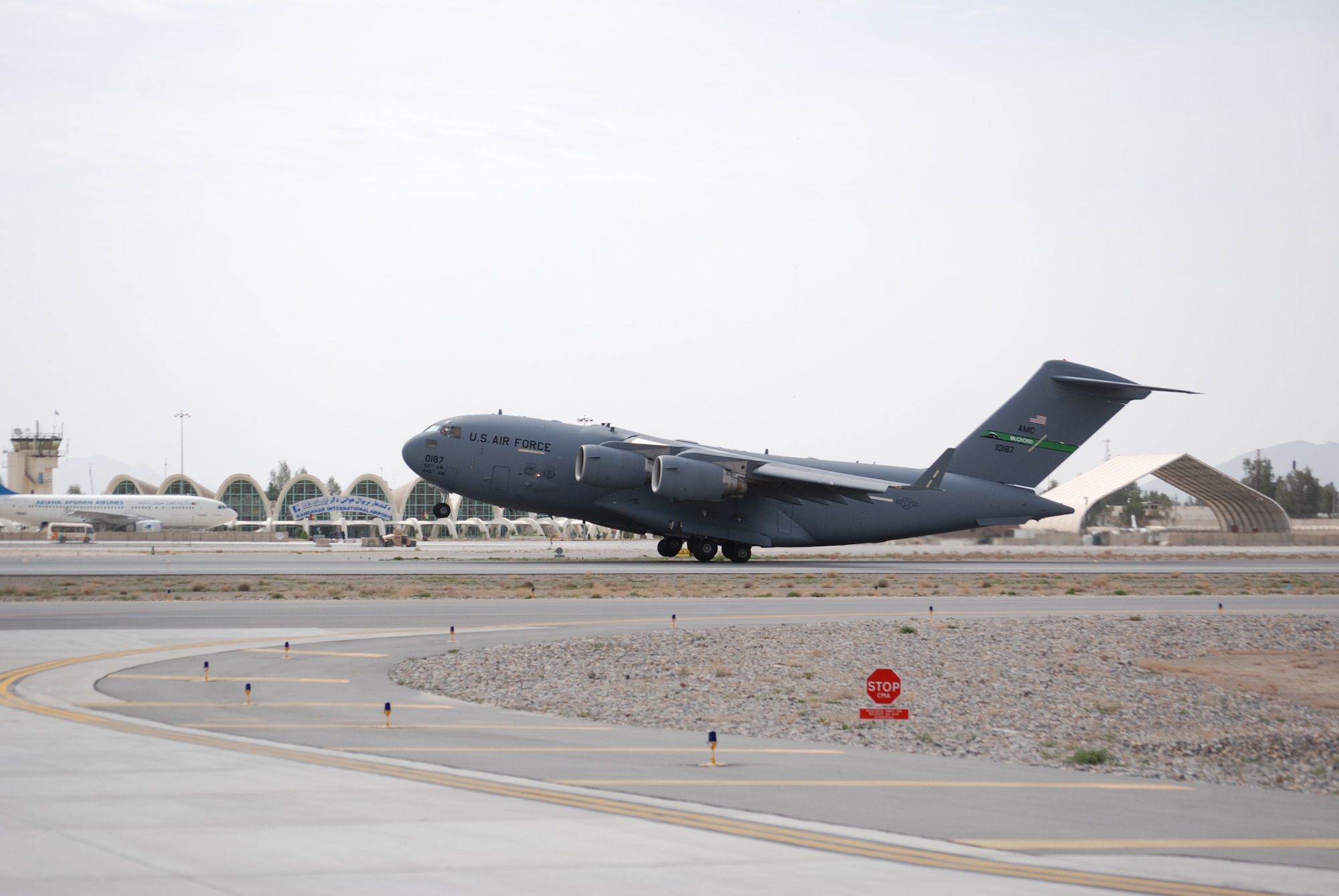 A C-17 Globemaster III departs from Kandahar Airfield, March 20, 2014. C-17s are frequently used to transport large vehicles, cargo and passengers in and out of Afghanistan. (U.S. Air Force photo by Capt. Brian Wagner/Released)