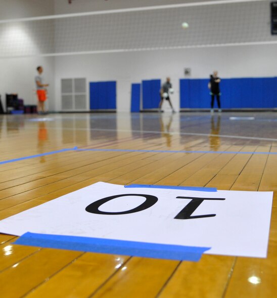 Tech. Sgt. Annemieke LeBorge, 509th Medical Operations Squadron NCO in-charge of occupational health, aims her serve while competing in a volleyball serve competition during the Whiteman Winter Olympics at Whiteman Air Force Base, Mo, Feb. 14, 2014. Competitors tried to get the highest score by attempting to land their serves in designated boxes labeled with different point values. (U.S. Air Force photo by Senior Airman Bryan Crane/released)