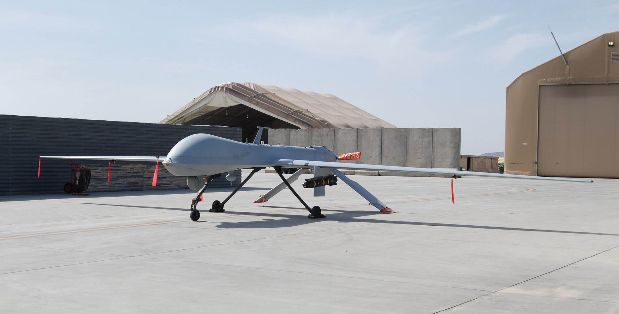An MQ-1 Predator sits on the ramp at Kandahar Airfield, March 19, 2014. The MQ-1 is assigned to and operated by the 451st Air Expeditionary Group. (U.S. Air Force photo by Capt. Brian Wagner/Released)
