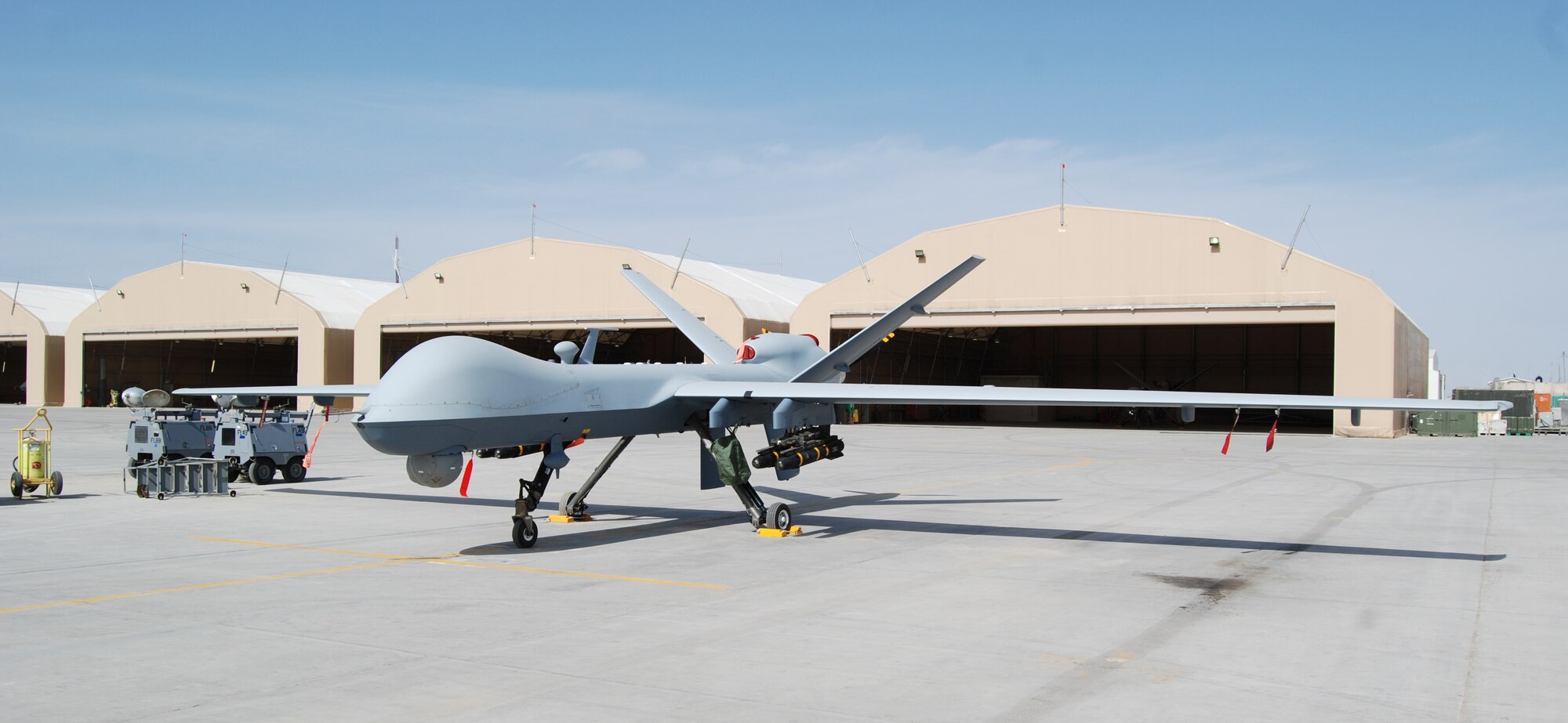 An MQ-9 Reaper sits on the ramp at Kandahar Airfield, March 19, 2014. The MQ-9 is assigned to and operated by the 451st Air Expeditionary Group. (U.S. Air Force photo by Capt. Brian Wagner/Released) (Image cropped to emphasize aircraft.)