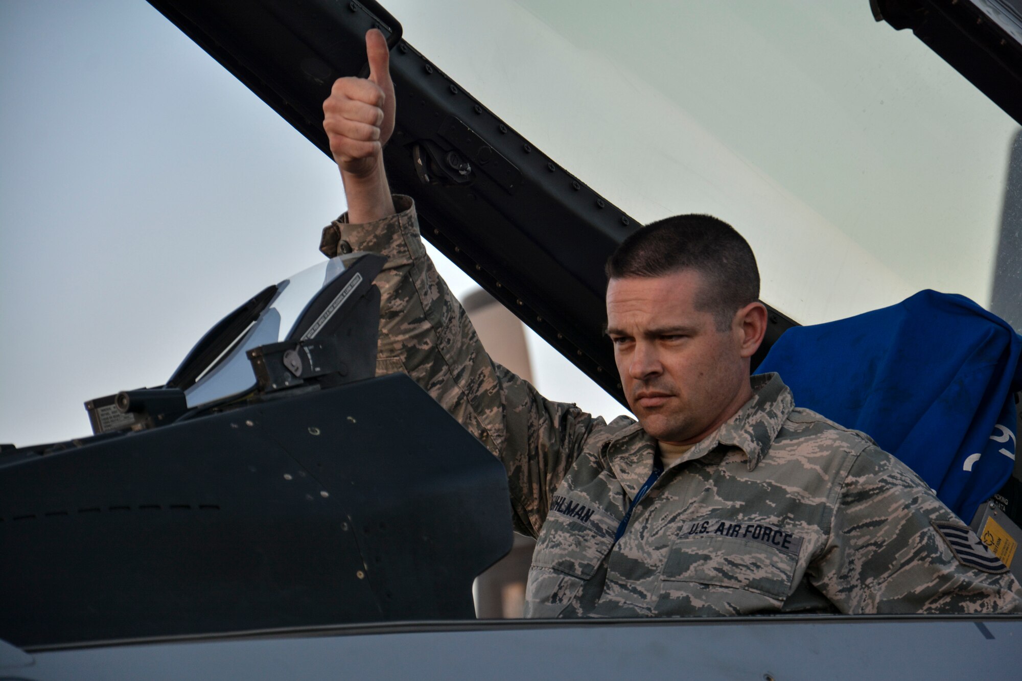 Tech. Sgt. Kyle Kuhlman, assigned to the 149th Fighter Wing with the Texas Air National Guard, gives a thumbs-up before other airmen begin to tow an F-16 Fighting Falcon at the FIDAE airshow in Santiago, Chile, March 24.  Nearly 60 U.S. airmen are participating in subject matter expert exchanges with Chilean air force counterparts during the week of FIDAE, and as part of the events will host static displays of the C-130 Hercules and F-16 Fighting Falcon during the FIDAE Air Show in Santiago, March 25 through 30. The exchanges, conducted regularly throughout the year, involve U.S. Airmen sharing best practices and procedures to build partnerships and promote interoperability with partner-nations throughout South America, Central America and the Caribbean. (U.S. Air Force photo by Capt. Justin Brockhoff/Released)