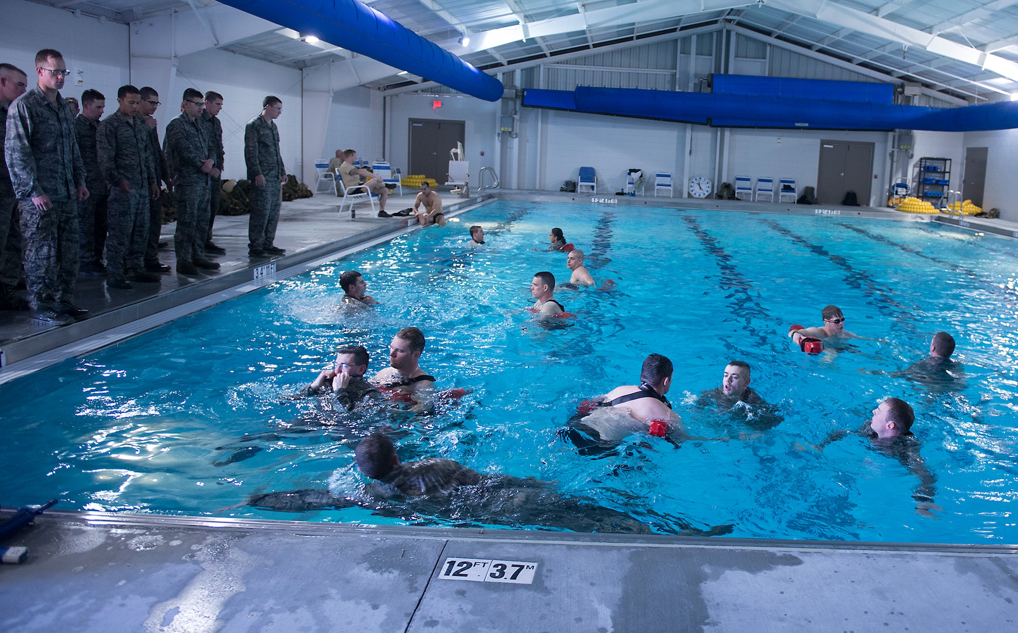 Air liaison officer (ALO) candidates endeavor an ALO aptitude assessment (AAA) to test their water confidence at Moody Air Force Base, Ga., March 19, 2014. ALOs are responsible for leading, training and equipping the enlisted Tactical Air Control Party Airmen that they are in charge of. The AAA is held to determine which candidates are most likely to make it through all facets of ALO training and ultimately join the career field to work alongside U.S. Army ground forces. (U.S. Air Force photo by Senior Airman Tiffany M. Grigg/Released) 