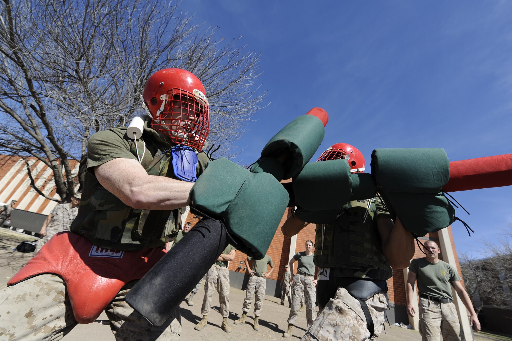 GOODFELLOW AIR FORCE BASE, Texas – Marines engage in pugil stick combat during Marine Corps Martial Arts Program training here March 18. The pugil sticks are used to practice rifle and bayonet and close quarters combat techniques. (U.S. Air Force photo/ Staff Sgt. Austin Knox)