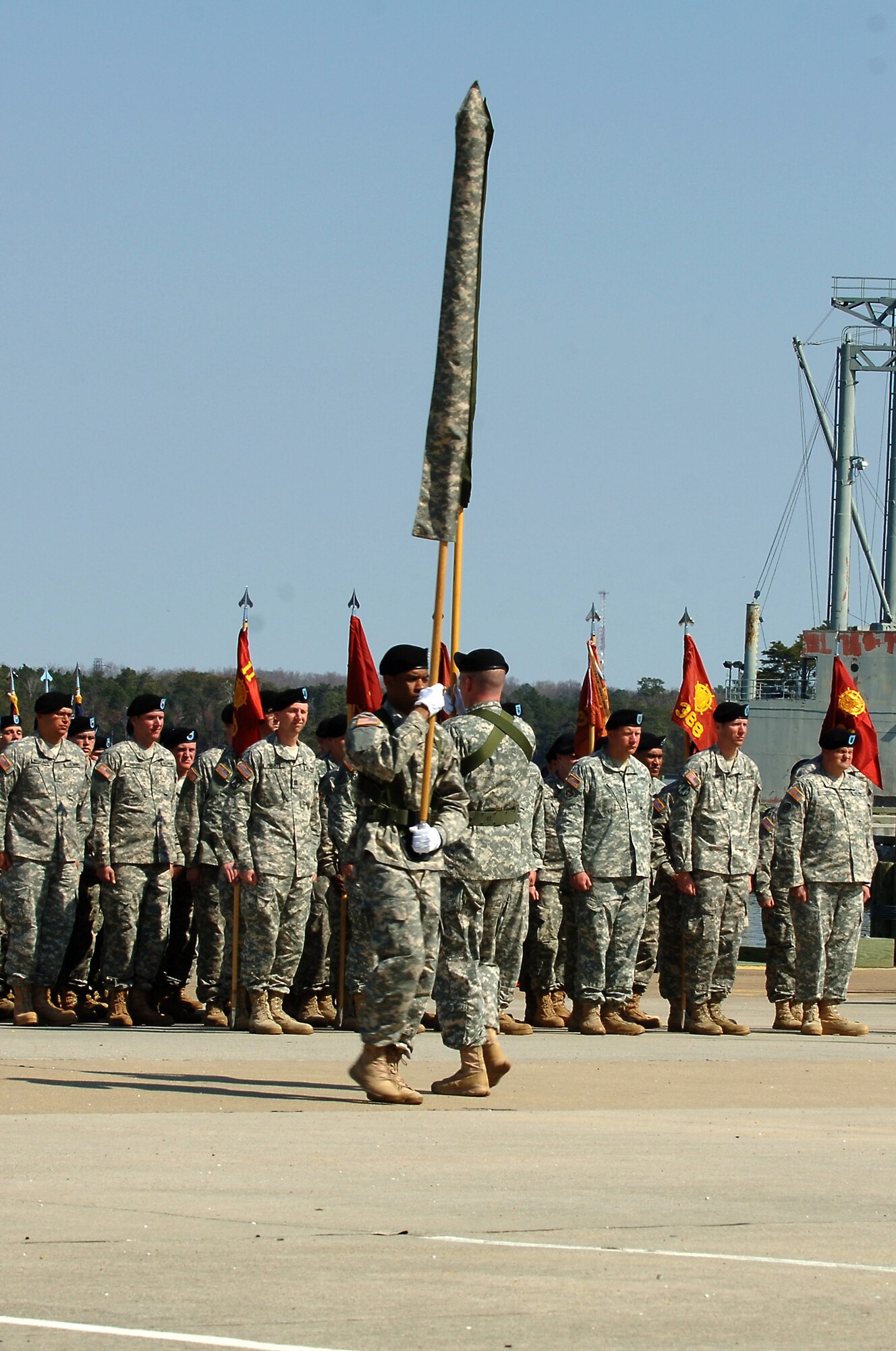 U.S. Army Soldiers of the 7th Transportation Brigade (Expeditionary) exchange the 7th Sustainment Bde. colors for the new 7th Trans. Bde. (Ex.) colors during a transformation ceremony at Fort Eustis, Va., March 21, 2014. The 7th Trans Bde. (Ex.) will plan and manage watercraft and water terminal support for theater operations, and commit terminal and watercraft assets in support of theater deployment and movement operations. (U.S. Air Force photo by Senior Airman Teresa J.C. Aber/Released)