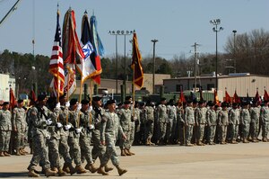 The Fort Eustis Honor Guard presents the colors during the transformation ceremony for the 7th Transportation Brigade (Expeditionary) at Fort Eustis, Va., March 21, 2014. The unit was activated during World War II as 7th Trans. Group (Composite), to command ports in the United Kingdom and Japan. (U.S. Air Force photo by Senior Airman Teresa J.C. Aber/Released)