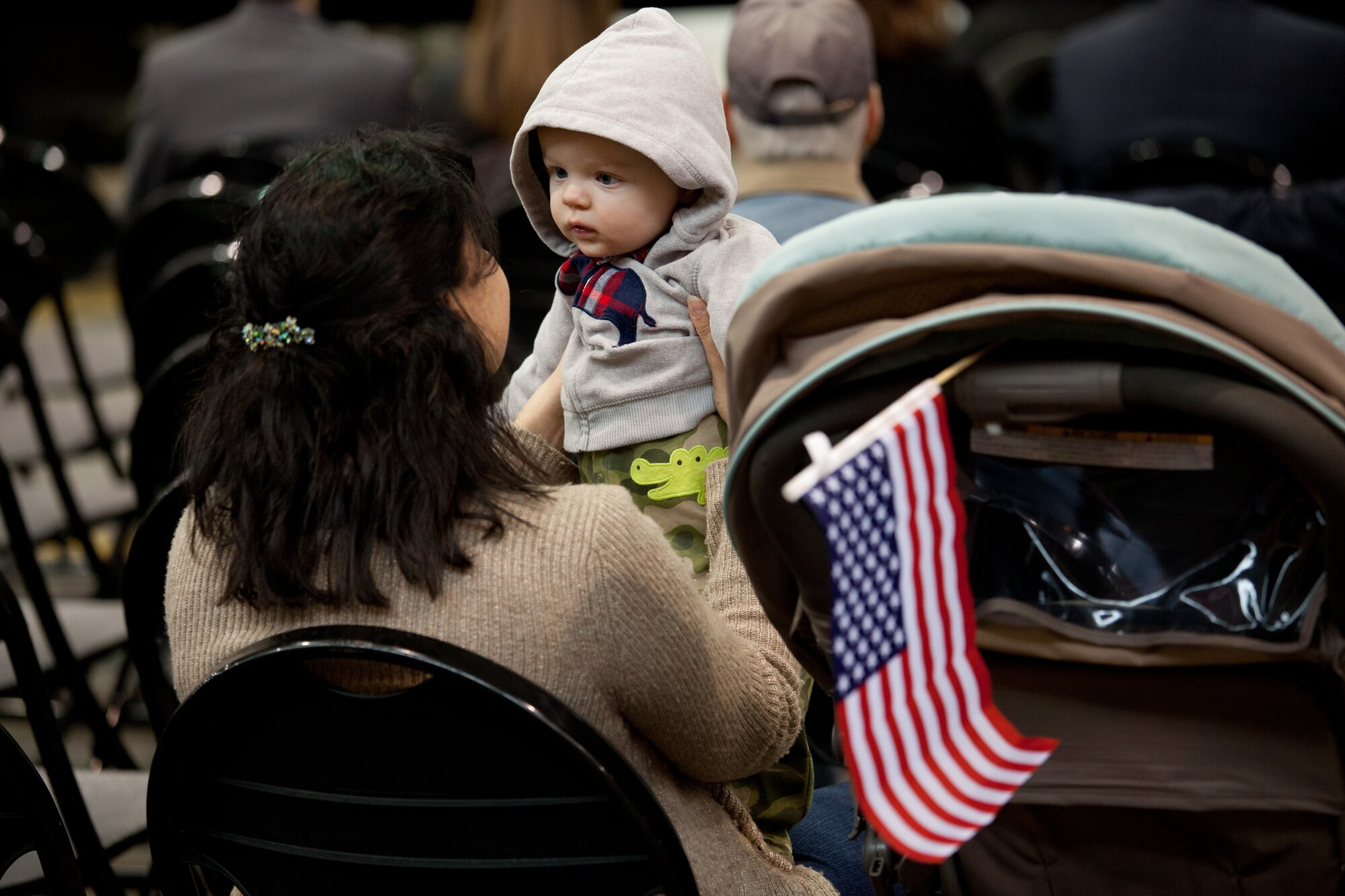 Members and family of the 102nd Intelligence Wing gather to say to their farewells to 31 members of the 212th Engineering Installation Squadron on Otis Air National Guard Base, Mass. on March 21, 2014. Members of the 212th will be deploying in support of Operation Enduring Freedom from late March to late November. (National Guard photo by Staff Sgt Jeremy Bowcock/Released)