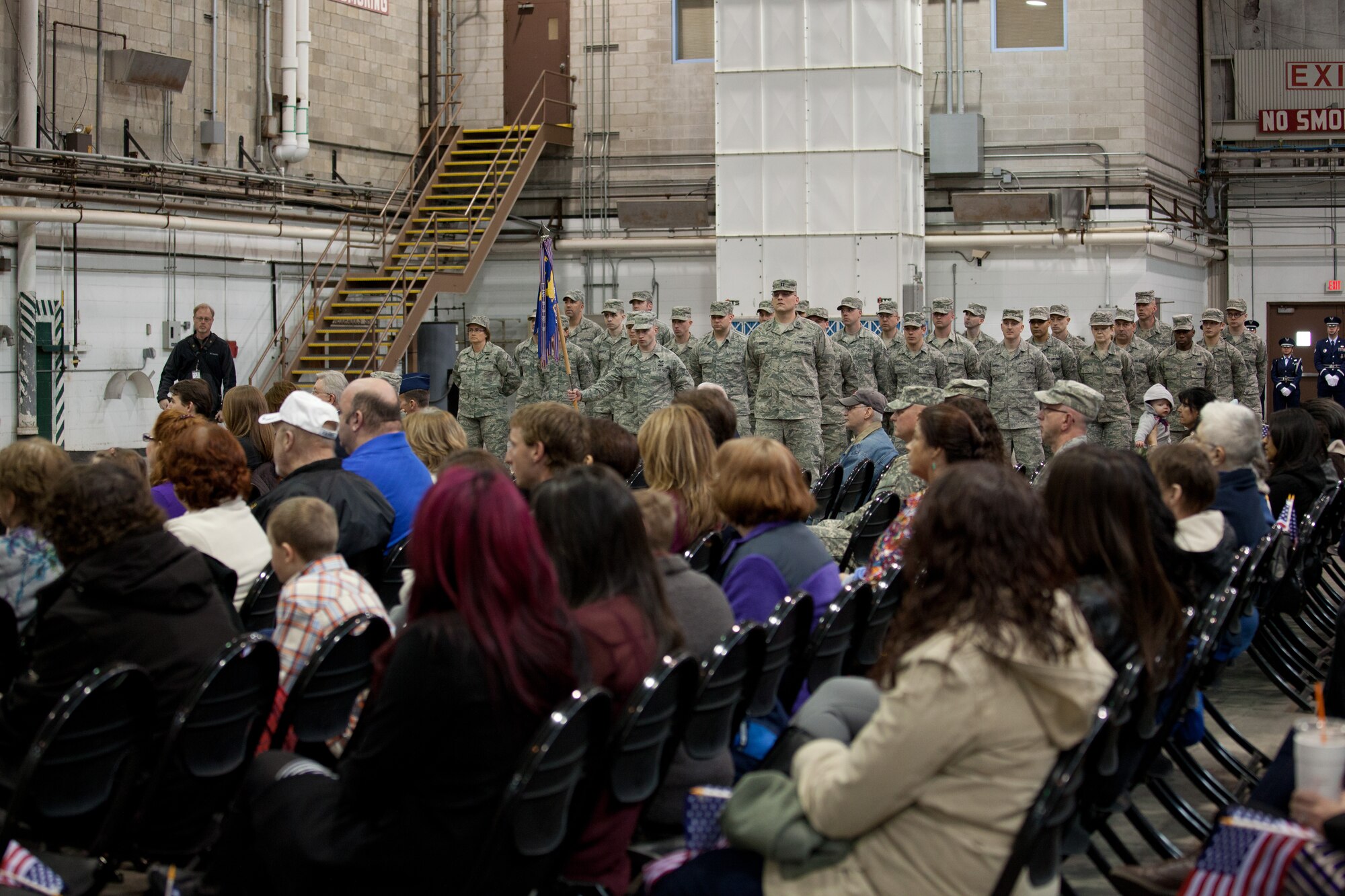Members and family of the 102nd Intelligence Wing gather to say to their farewells to 31 members of the 212th Engineering Installation Squadron on Otis Air National Guard Base, Mass. on March 21, 2014. Members of the 212th will be deploying in support of Operation Enduring Freedom from late March to late November. (National Guard photo by Staff Sgt Jeremy Bowcock/Released)