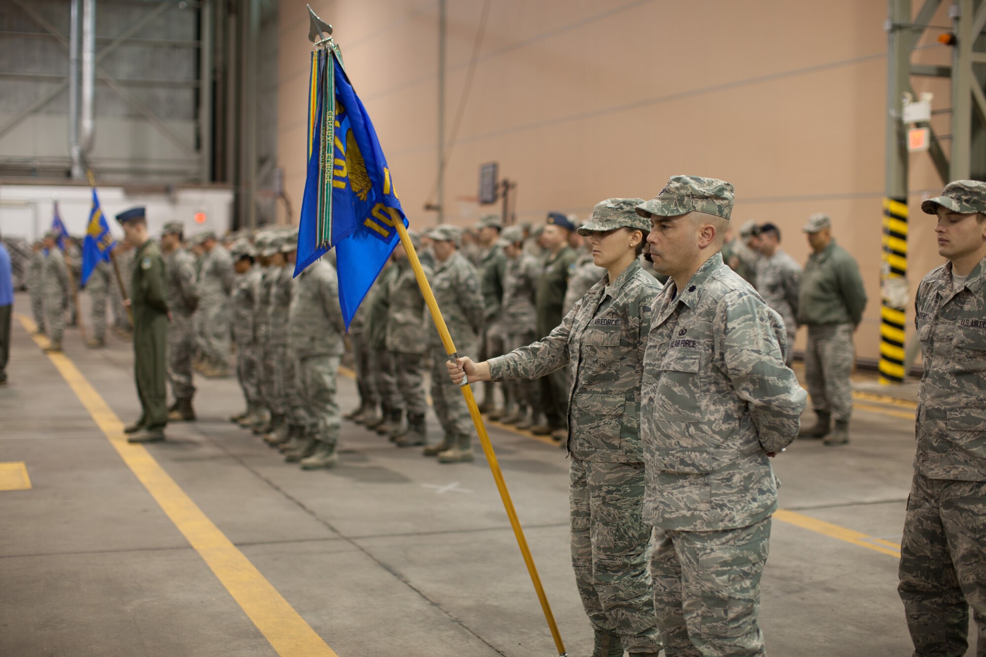 Members and family of the 102nd Intelligence Wing gather to say to their farewells to 31 members of the 212th Engineering Installation Squadron on Otis Air National Guard Base, Mass. on March 21, 2014. Members of the 212th will be deploying in support of Operation Enduring Freedom from late March to late November. (National Guard photo by Staff Sgt Jeremy Bowcock/Released)