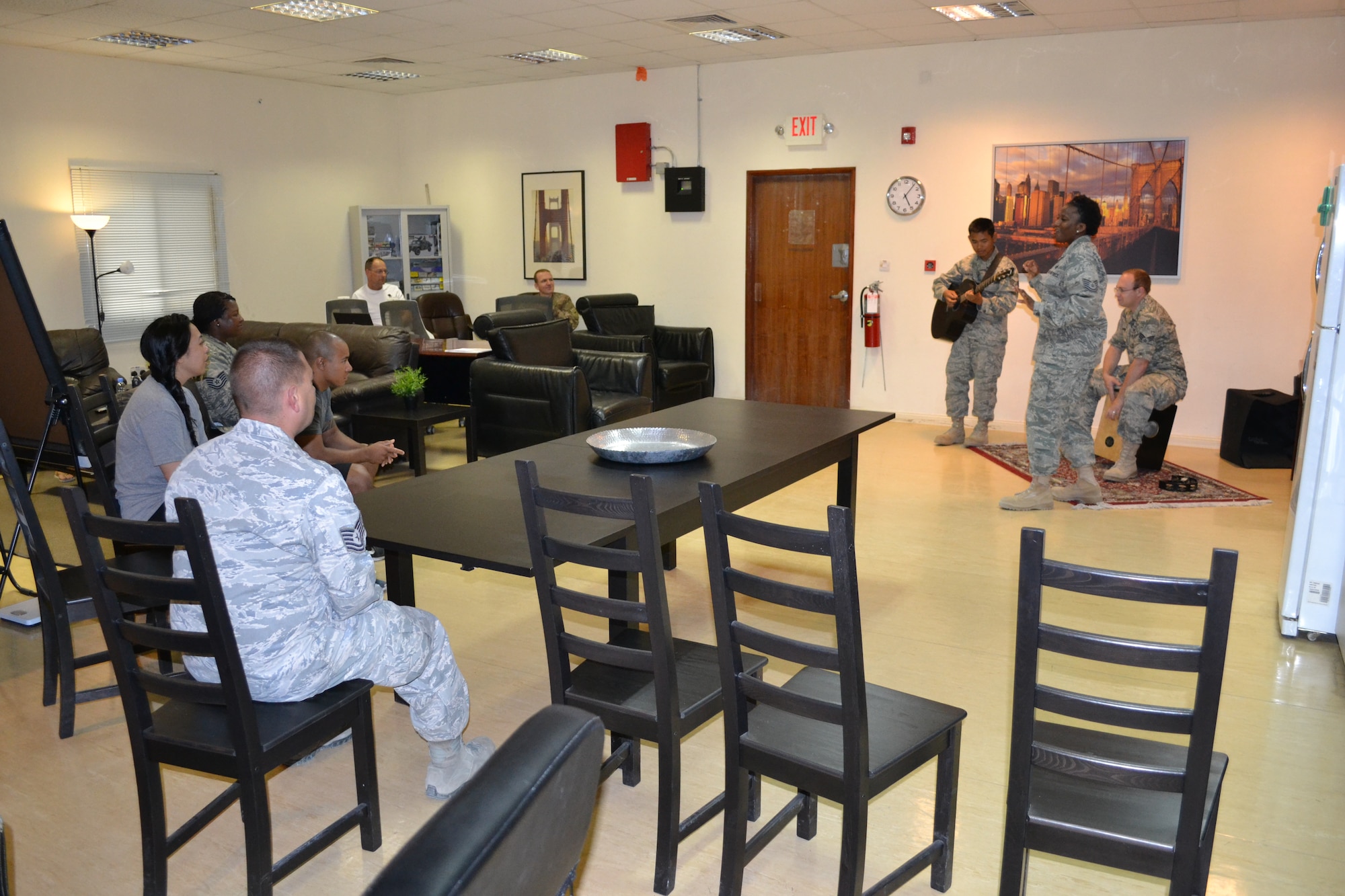 Members of “Hypersonic” assigned to U.S. Air Forces Central Command, perform for patients and staff at the Intra-Theater Care Program at Al Udeid Air Base, Qatar, Mar. 24, 2014.  The ITCP is the only recovery facility in the Central Command area of responsibility and wounded warriors from all services are sent here for treatment and recovery in order to return to their deployed location.  As members of the AFCENT band, this trio is an acoustic ensemble with voice, guitar, and cajon, offering a wide variety of hit songs from genres such as jazz, pop, rock and country to help boost morale and decrease stress, helping patients heal.   “Hypersonic” is deployed from Yokota Air Base, Japan and is preparing to tour several bases throughout Afghanistan in April, along with the other band members.  (U.S. Air Force Photo by Maj. Nicole David)