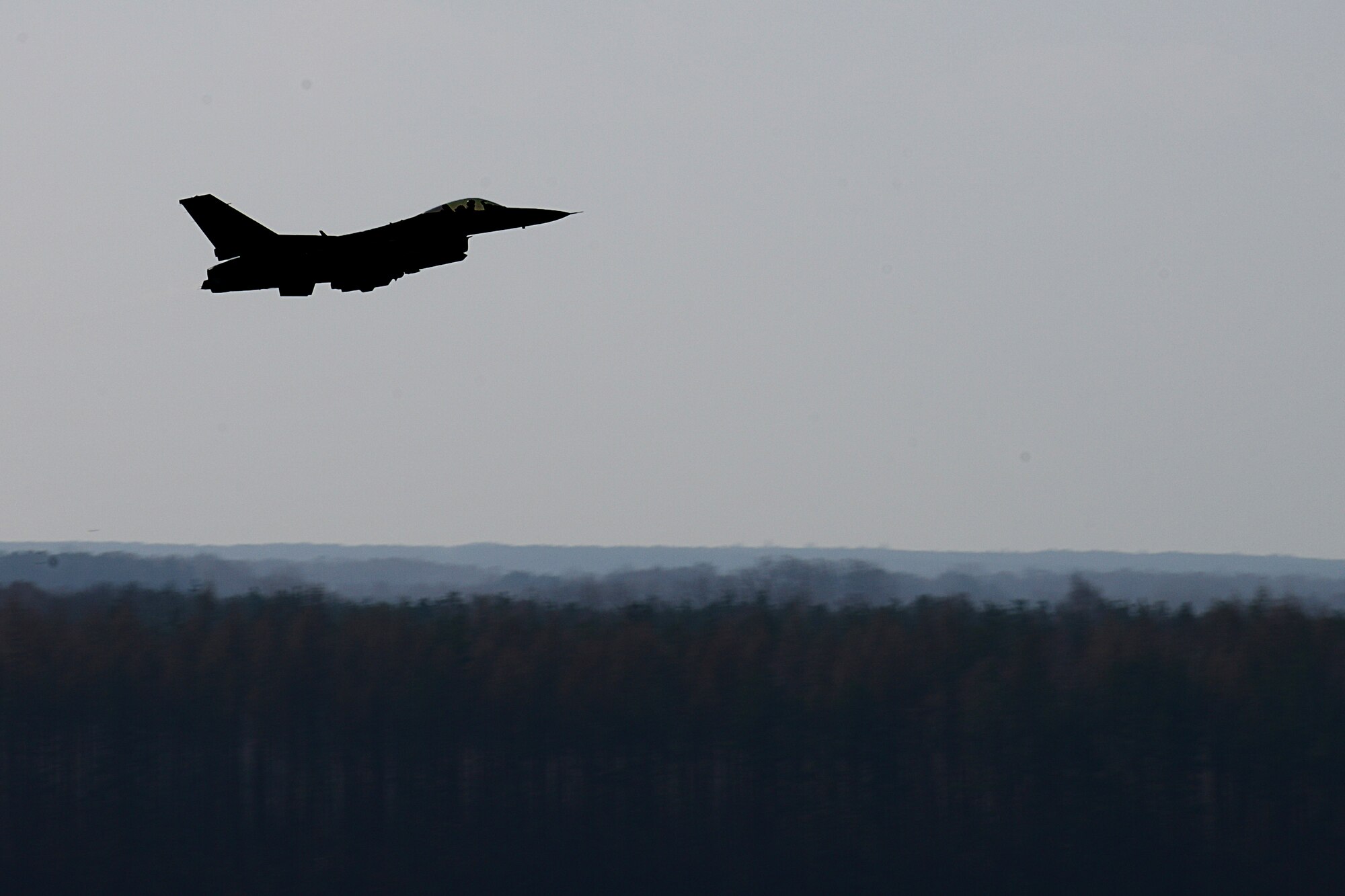 A 555th Fighter Squadron F-16 Fighting Falcon takes off, March 20, 2014, from Łask Air Base, Poland. Twelve F-16’s from Aviano Air Base, Italy, are augmenting the on-going joint training operation at Łask along with approximately 200 supporting military personnel. The offsite training and movement of 31st Fighter Wing resources emulates the recently adapted “Forward, Ready, Now” initiative by Gen. Frank Gorenc, U.S. Air Forces in Europe, U.S. Air Forces in Africa commander. (U.S. Air Force photo/Airman 1st Class Ryan Conroy/Released) 