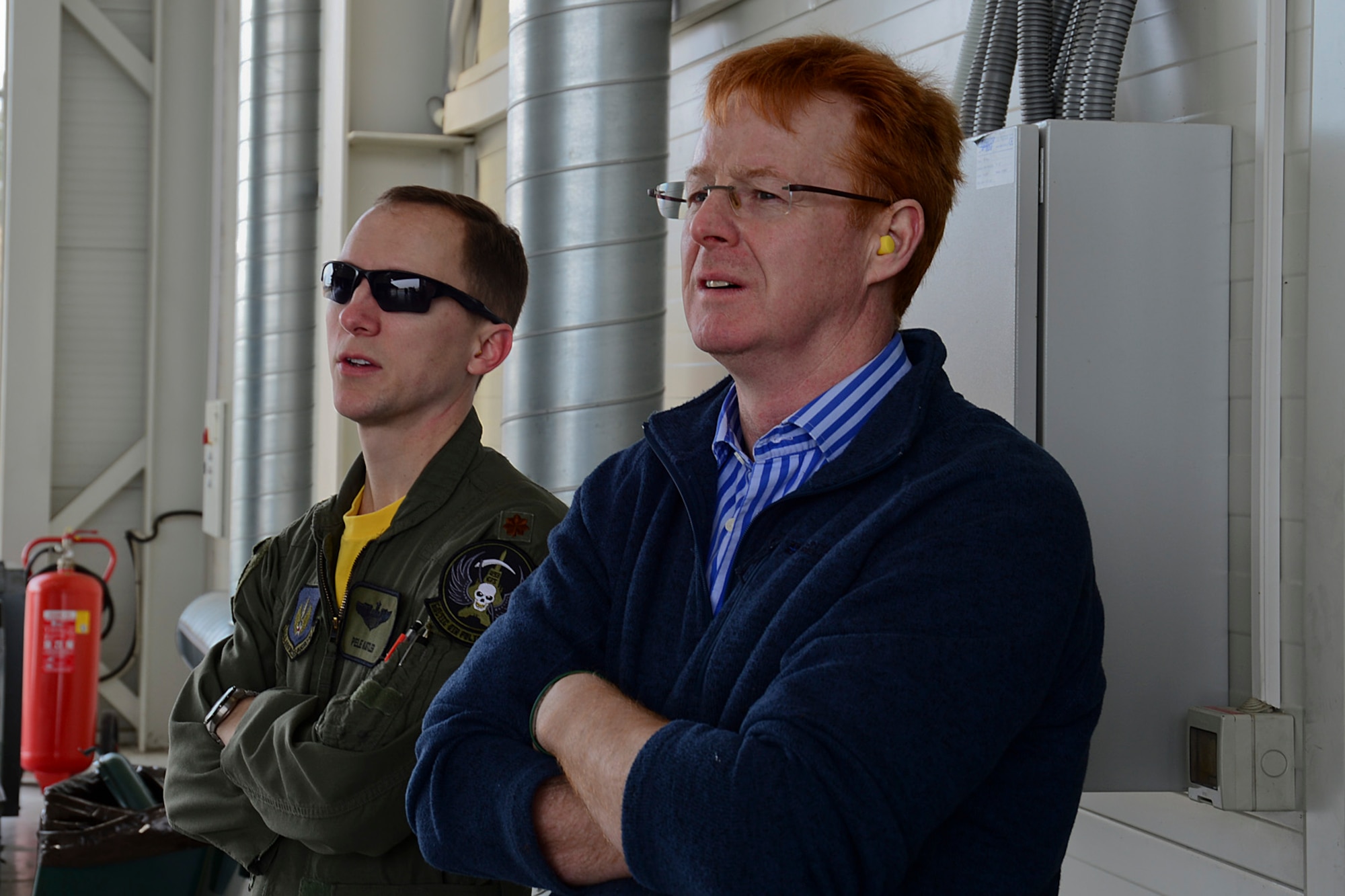 Maj. Charles Kistler, 493rd Expeditionary Fighter Squadron pilot and Royal British Army Lt. Col. Fitz Fitzgibbon, British Embassy Defence Attaché, watch an F-15C Eagle scramble during an alert training mission at Šiauliai Air Base, Lithuania, March 21, 2014. The U.S. Air Force F-15C Eagles' participation in the NATO Baltic Air Policing mission helps ensure a safe and stable future for the Baltics while preserving the integrity of NATO's borders and NATO security. (U.S. Air Force photo by Airman 1st Class Dana J. Butler/Released) 