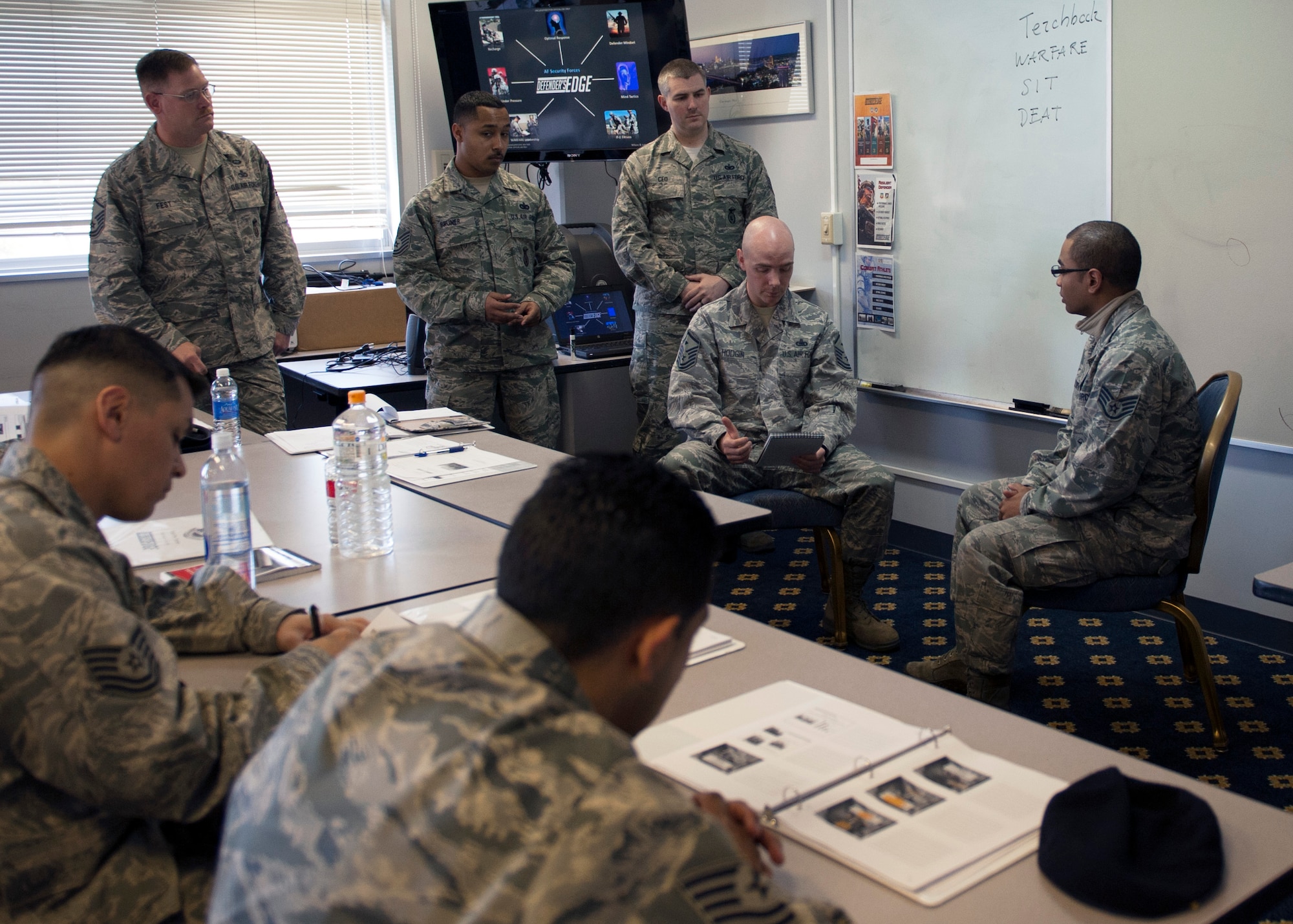 Airmen demonstrate their knowledge through a scenario at a Defender’s Edge training Mar. 19, 2014, at Yokota Air Base, Japan. Approximately 20 defenders participated in the training, which focuses on resiliency specific to security forces personnel. (U.S. Air Force photo by Senior Airman Desiree Economides)