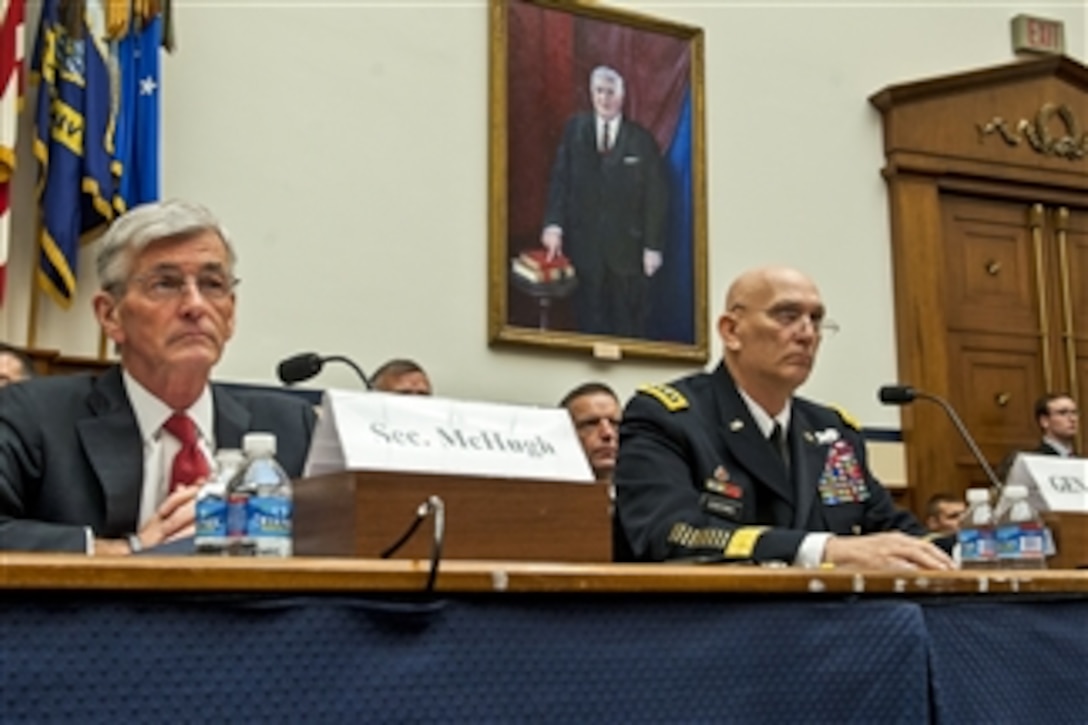 Army Secretary John M. Mchugh and Army Chief of Staff Gen. Ray Odierno listen to opening remarks from the members of the House Armed Services Committee before they testified in Washington, D.C., March 25, 2014.
