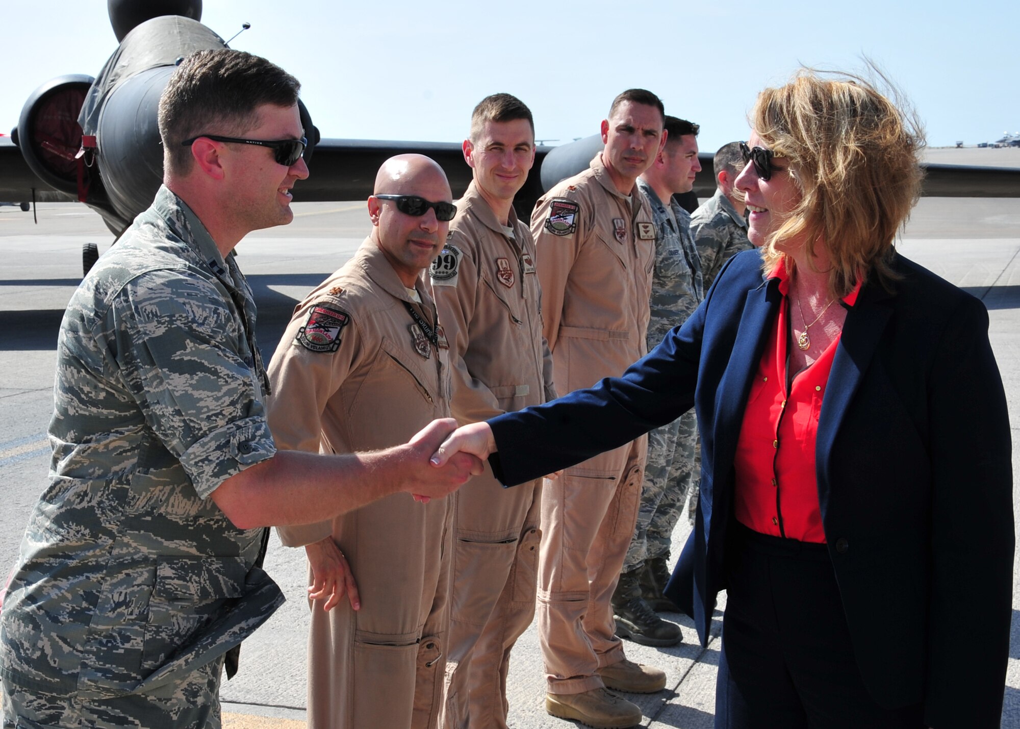 Secretary of the Air Force Deborah Lee James greets Airmen during a flight line tour at the 380th Air Expeditionary Wing March 19, 2014, at an undisclosed location in Southwest Asia. During her visit James held an all call, speaking on three priorities: Taking care of people, balancing today's readiness with tomorrow's readiness and making every dollar count. (U.S. Air Force photo/Staff Sgt. Michael Means) 