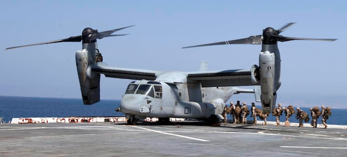U.S. Marines with Battalion Landing Team 1st Battalion, 6th Marine Regiment, 22nd Marine Expeditionary Unit (MEU), board an MV-22 Osprey aircraft with Marine Medium Tiltrotor Squadron (VMM) 263 (Reinforced), 22nd MEU, aboard the USS Mesa Verde (LPD 19) in support of an exercise. The 22nd MEU is deployed with the Bataan Amphibious Ready Group as a theater reserve and crisis response force throughout U.S. Central Command and the U.S. 5th Fleet area of responsibility. (U.S. Marine Corps photo by Staff Sgt. Lukas Atwell/Released)