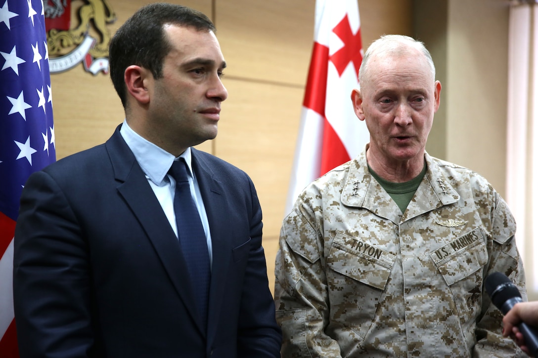 United States Marine Corps Lt. Gen. Richard Tryon, commander of U.S. Marine Corps Forces Command and U.S. Marine Corps Forces, Europe, and Georgian Minister of Defense Irakli Alasania both speak to the local press in Tbilisi, March 19, 2014. Tryon visited Georgia to attend the departure ceremony for the Georgian Special Mountain Battalion and 23rd Bn., who are deploying to Afghanistan as part of the International Security Assistance Force, and he met with Georgian military officials. (Official Marine Corps photo by Lance Cpl. Scott W. Whiting, BSRF PAO/ Released)