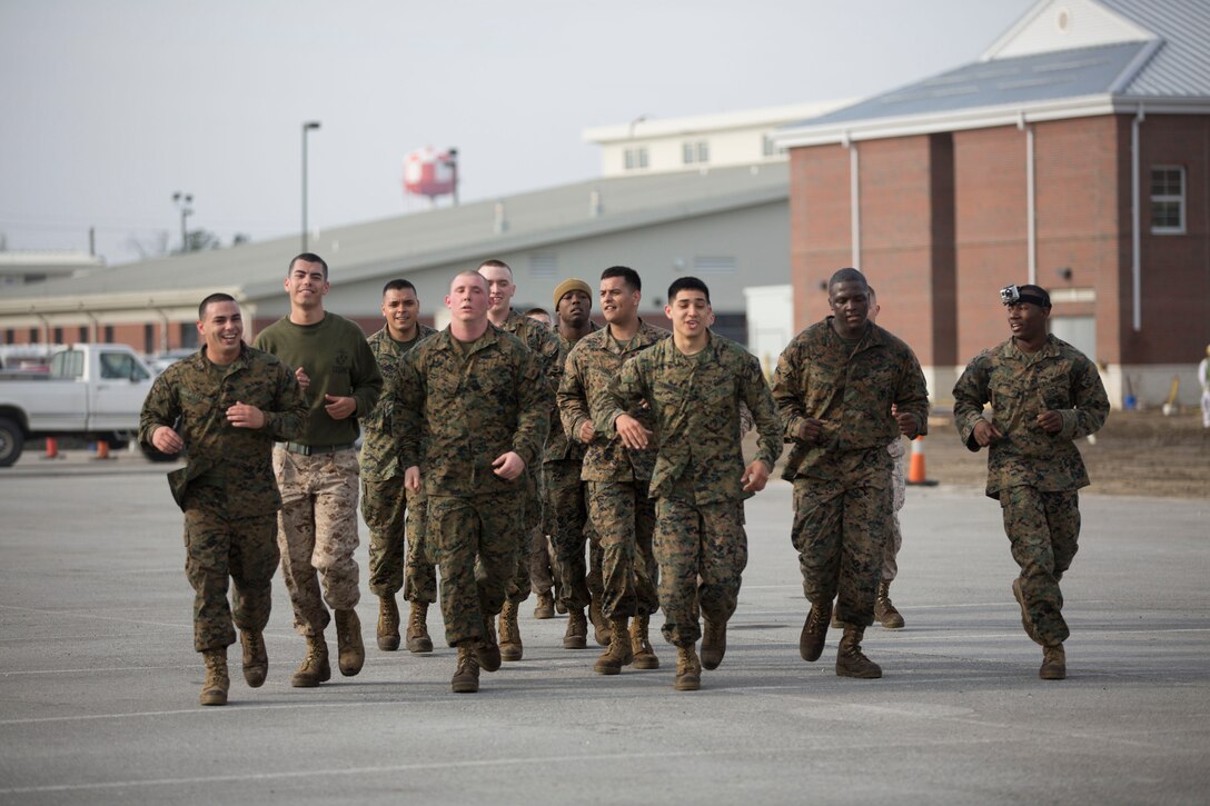 Members of Headquarters Support Battalion run together as part of the stamina course, during the Commander’s Cup Challenge at Stone Bay aboard Marine Corps Base Camp Lejeune, March 20. 
   
