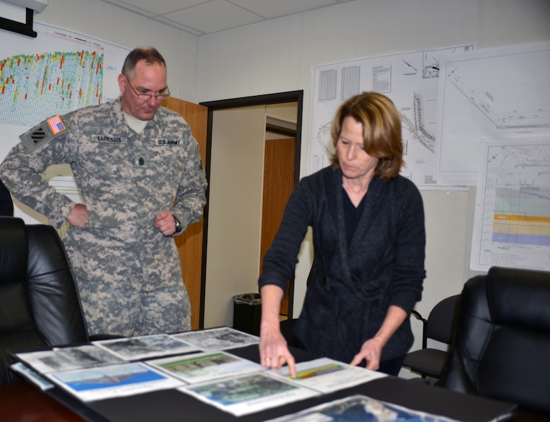 Linda Adcock,Center Hill Dam project manager,from the Nashville District briefs U.S. Army Corps of Engineers' senior enlisted adviser Command Sgt. Maj. Karl J. Groninger on the foundation rehabilitation progress and construction on March 17, 2014 at the Center Hill dam resident managers office.  