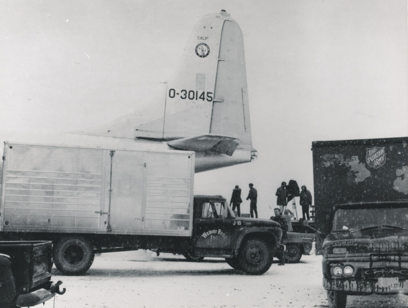Operation Helping Hand included aircraft such as this C-97 from the 146th Transport Wing, California Air National Guard, Van Nuys, Calif., flying relief supplies distributed by volunteers.