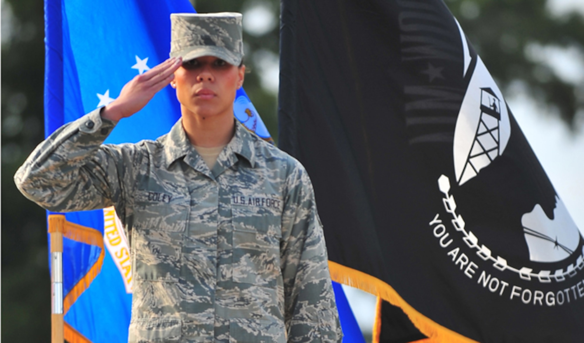Senior Airman Amber Coley renders a salute as the U.S. military Code of Conduct is recited during the 4th Fighter Wing Prisoner of War/Missing in Action ceremony Sept. 20, 2013, at Seymour Johnson Air Force Base, N.C. The Code of Conduct, in six articles, addresses basic information useful to POWs when captured by hostile forces. Coley is 4th Medical Operations Squadron physical therapy technician. (U.S. Air Force photo/Senior Airman Aubrey White)