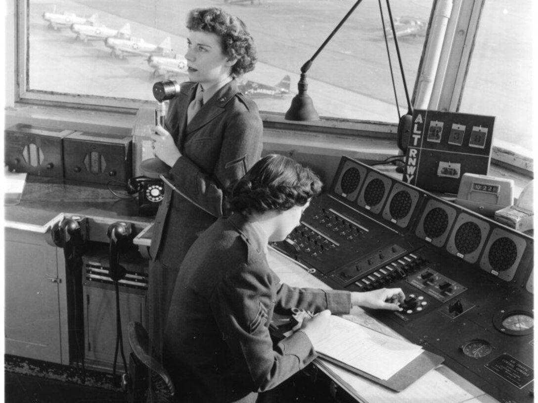 Female Marines perform their duties as air traffic controllers during the Korean War. During the war, women were encouraged to take on more roles in different military occupations than before to free up men for combat.