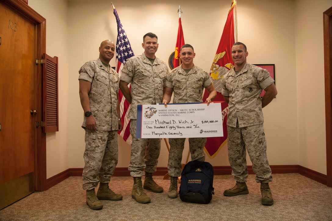 Cpl. Michael Wick is awarded the Naval Reserve Officers Training Corps scholarship valued at $180,000 at 12MCD headquarters, Marine Corps Recruit Depot, San Diego, March 24. 