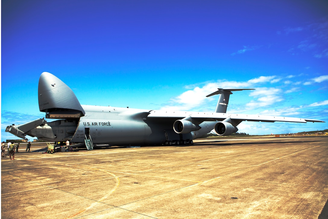 Marines load a CH-53E Super Stallion helicopter with Marine Heavy Helicopter Squadron 463 onto a U.S. Air Force C-5 Galaxy at Marine Corps Air Station Kaneohe Bay here, March 23. This year’s deployment marks the first time an Aviation Combat Element has supported Marine Rotational Force – Darwin, a six-month deployment to Australia.