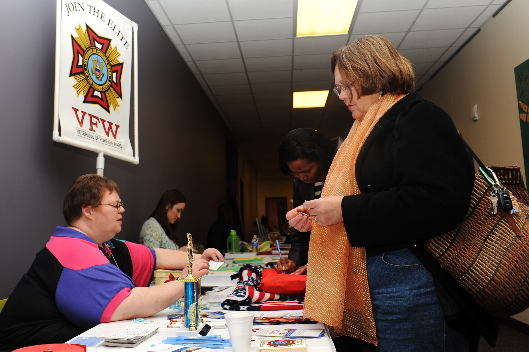 A representative from the Veterans of Foreign Wars provided information about their organization to veterans during the No Family Left Behind conference at Faith Family Church March 14, 2014. Military members, veterans and their families were invited to the conference to learn more information about mental health issues and resources to get help for it. (U.S. Air Force photo/Airman 1st Class Megan Friedl)