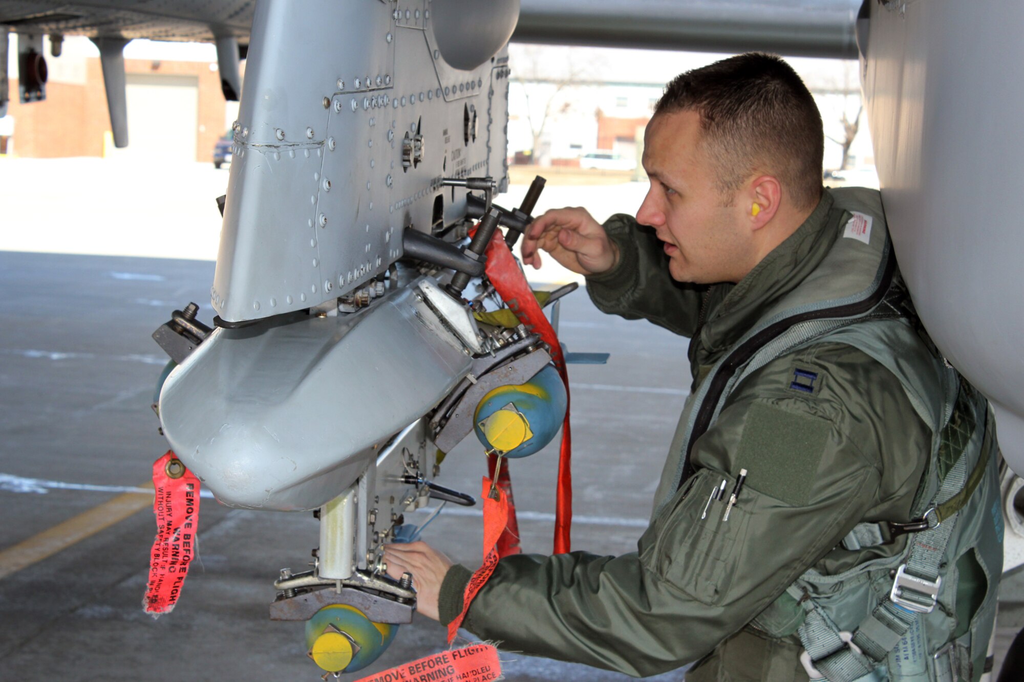 140326-Z-VA676-015 - Capt. Brett DeVries, a pilot with the 107th Fighter Squadron, conducts a pre-flight inspection of an A-10 Thunderbolt II aircraft at Selfridge Air National Guard Base, Mich., March 26, 2014. The 107th, part of the Michigan Air National Guard’s 127th Wing, was participating in a Combat Search and Rescue Exercise at the Grayling Air Gunnery Range in northern Michigan, in conjunction with the 122nd Fighter Wing, Indiana Air National Guard, and the New York Air National Guard’s 106th Rescue Wing. (U.S. Air National Guard photo by TSgt. Dan Heaton / Released)