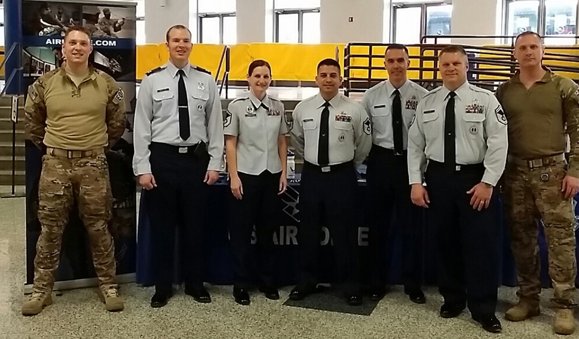 Recruiters and Explosive Ordnance Disposal Airman pose for a photo at the Scottrade Center in St. Louis. From left are Airman 1st Class Brandon Thomas, Capt. Brian Kroeger, Master Sgt. Darlene Poindexter, Master Sgt. Johnny Martinez, Master Sgt. Andrew Flores, Senior Master Sgt. Jeffrey Colvin and Staff Sgt. Steven Zachman. (Courtesy photo)