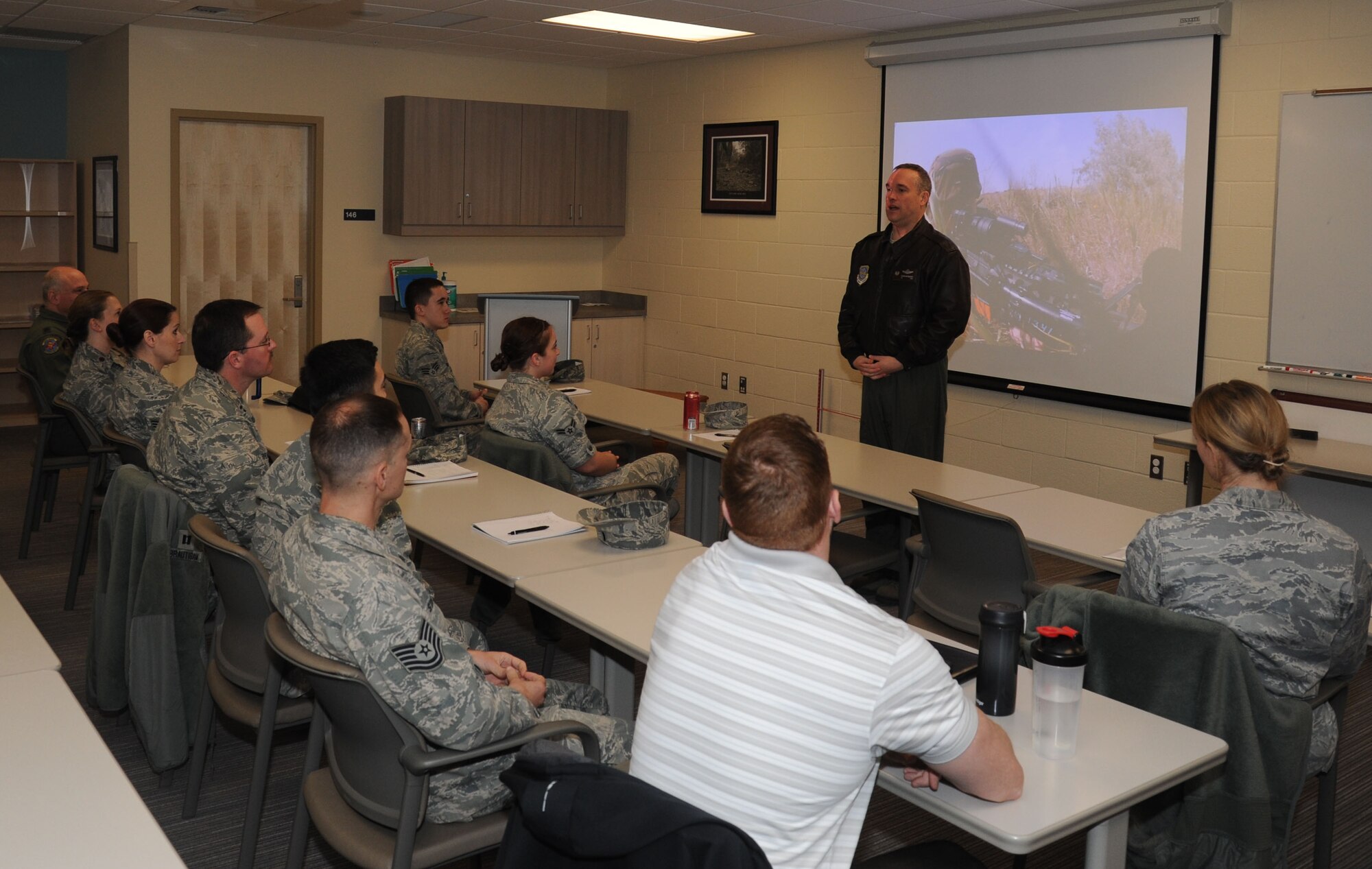 Col. Brian Newberry speaks with AFSO21 attendees primarily from the 92nd Medical Group at Fairchild Air Force Base, Wash., March 24, 2014. Newberry asked the attendees to help him identify inefficiencies, as dictated by the program. Newberry is the 92nd Air Refueling Wing commander. (U.S. Air Force photo by Airman 1st Class Sam Fogleman/Released)