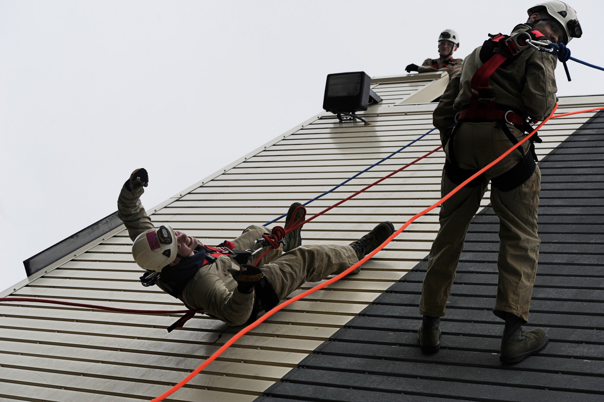 11th Civil Engineer Squadron fire protection firefighters, Airman 1st Class Jared Becker and crew chief Staff Sgt. Christopher Hale repel from a building during fire rescue training scenario at the Fire Training Area on Joint Base Andrews, Md., March 19, 2014. (U.S. Air Force photo/Airman 1st Class Nesha Humes)