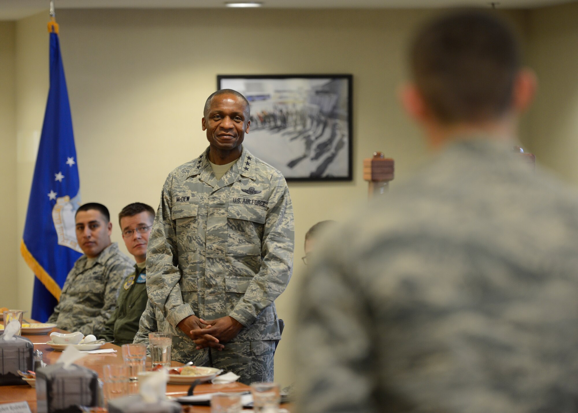 Lt. Gen. Darren McDew, 18th Air Force commander, listens while an Airman asks a question during a breakfast with Team Dover Airmen March 25, 2014, at the dining facility on Dover Air Force Base, Del. Lt. Gen. McDew answered questions ranging from force shaping to his advice for a successful career. (U.S. Air Force photo/Greg L. Davis)