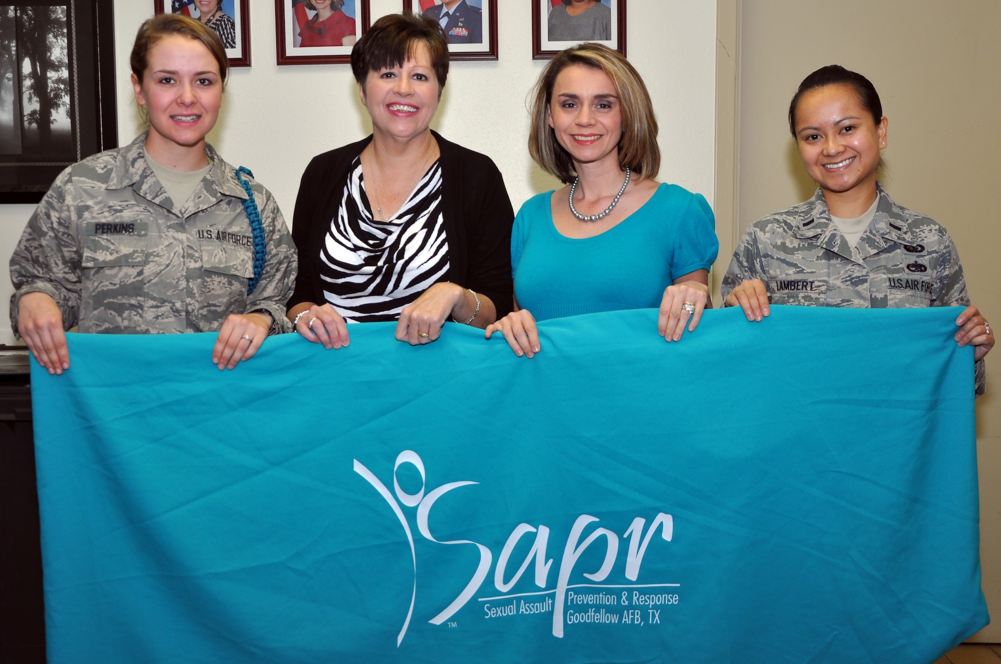 GOODFELLOW AIR FORCE BASE, Texas -- Airman Allison Perkins, 316th Training Squadron teal rope, Laurel L. Matus, 17th Training Wing Sexual Assault Prevention and Response victim advocate, Donna L. Casey, 17th TRW Sexual Assault Response Coordinator, and 1st Lt. Glenna V. Lambert, 17th TRW deputy SARC, pose for a picture at the SARC Office here March 26. The SARC Office also includes members at the 517th Training Group. The Air Force announced the 17th TRW SAPR Office with the SAPR Program of the Year March 19. (U.S. Air Force photo/ Airman 1st Class Breonna Veal)
